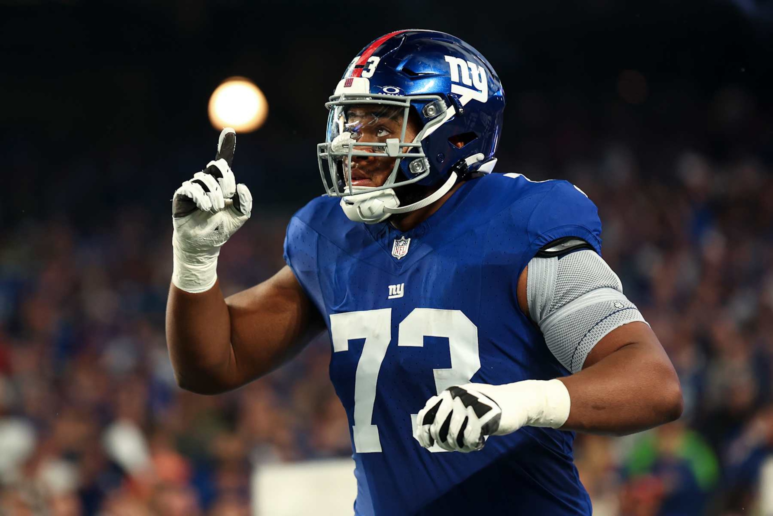 EAST RUTHERFORD, NJ - OCTOBER 2: Evan Neal #73 of the New York Giants runs out of the tunnel prior to an NFL football game against the Seattle Seahawks at MetLife Stadium on October 2, 2023 in East Rutherford, New Jersey. (Photo by Kevin Sabitus/Getty Images)