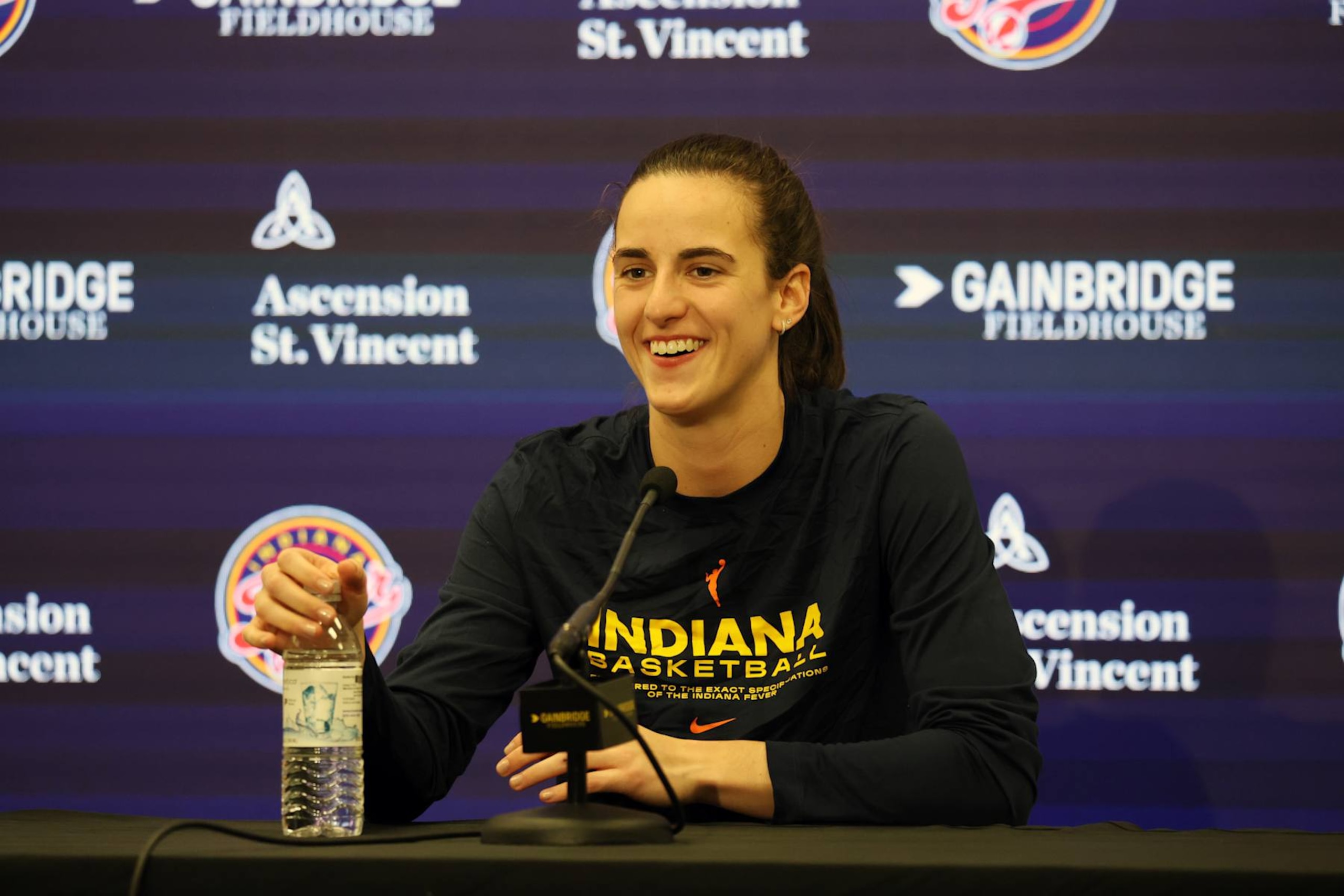 INDIANAPOLIS, IN - AUGUST 16: Indiana Fever guard Caitlin Clark (22) talks to the media during a press conference before the game against the Phoenix Mercury at Gainbridge Fieldhouse on August 16, 2024 in Indianapolis, Indiana. (Photo by Brian Spurlock/Icon Sportswire via Getty Images)