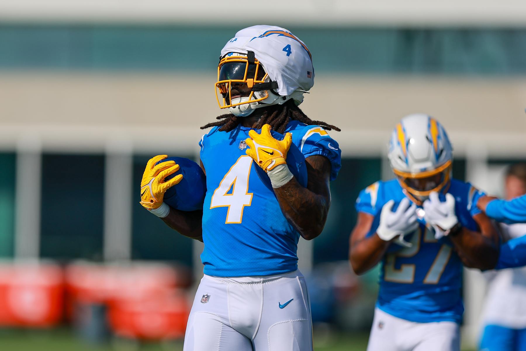 EL SEGUNDO, CA - JULY 24: Los Angeles Chargers running back Gus Edwards (4) holds the ball during drills during the Los Angeles Chargers Training Camp on July 24, 2024, at The Bolt in El Segundo, CA. (Photo by Jordon Kelly/Icon Sportswire via Getty Images)