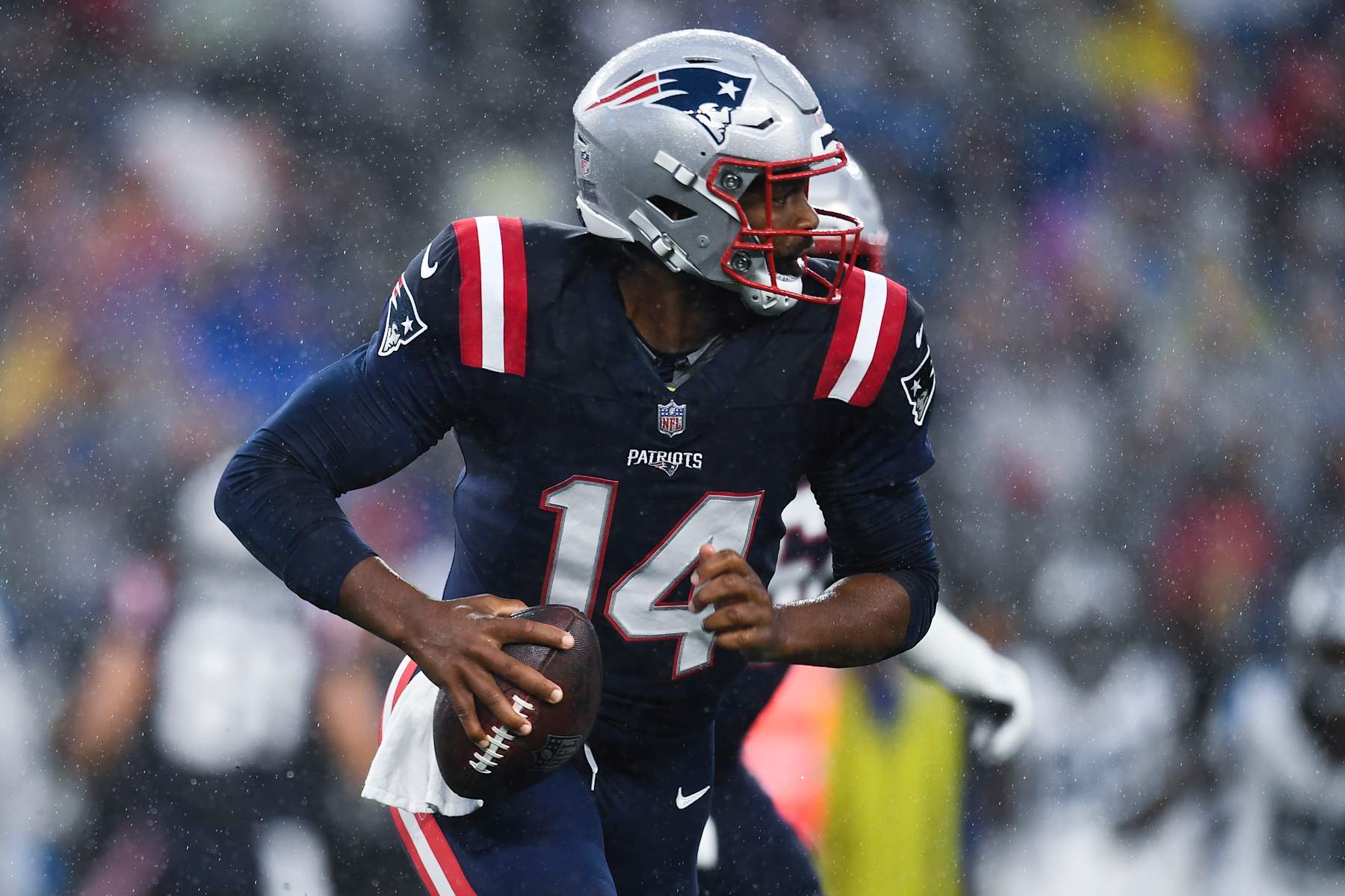 FOXBOROUGH, MASSACHUSETTS - AUGUST 08: Jacoby Brissett #14 of the New England Patriots looks to make a pass during the first quarter of a preseason game against the Carolina Panthers at Gillette Stadium on August 08, 2024 in Foxborough, Massachusetts. (Photo by Jaiden Tripi/Getty Images)
