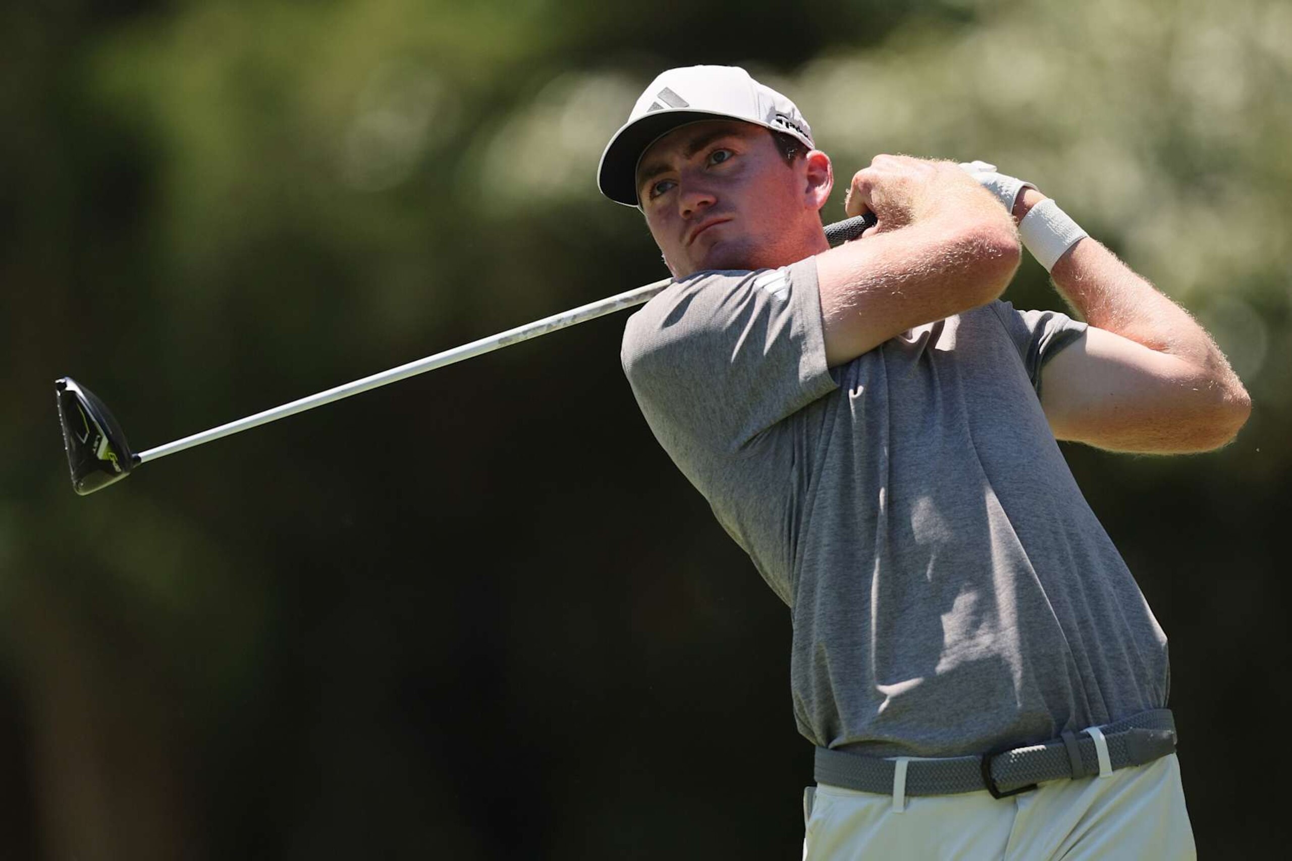 MEMPHIS, TENNESSEE - AUGUST 17: Nick Dunlap of the United States plays his shot from the seventh tee during the third round of the FedEx St. Jude Championship at TPC Southwind on August 17, 2024 in Memphis, Tennessee. (Photo by Andy Lyons/Getty Images)