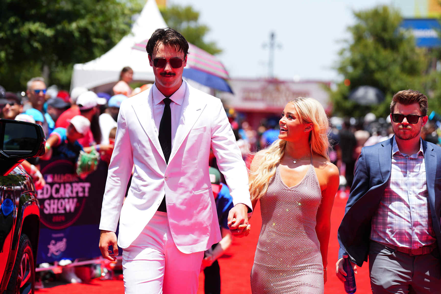 ARLINGTON, TX - JULY 16: Paul Skenes #30 of the Pittsburgh Pirates and Livvy Dunne looks on during the 2024 All-Star Red Carpet Show presented by Frutitas Agua Fresca at Globe Life Field North Plaza on Tuesday, July 16, 2024 in Arlington, Texas. (Photo by Cooper Neill/MLB Photos via Getty Images)
