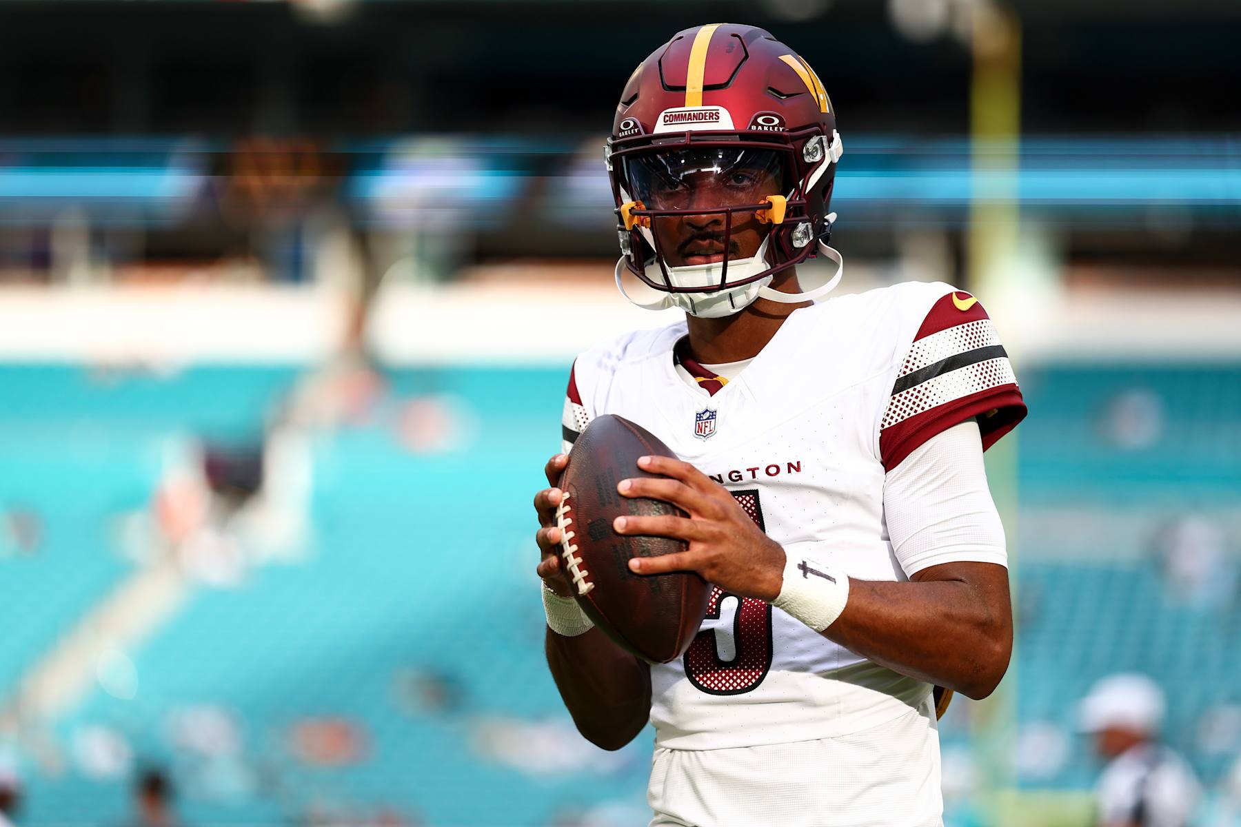 MIAMI GARDENS, FL - AUGUST 17: Jayden Daniels #5 of the Washington Commanders warms up prior to an NFL preseason football game against the Miami Dolphins at Hard Rock Stadium on August 17, 2024 in Miami Gardens, Florida. (Photo by Kevin Sabitus/Getty Images)