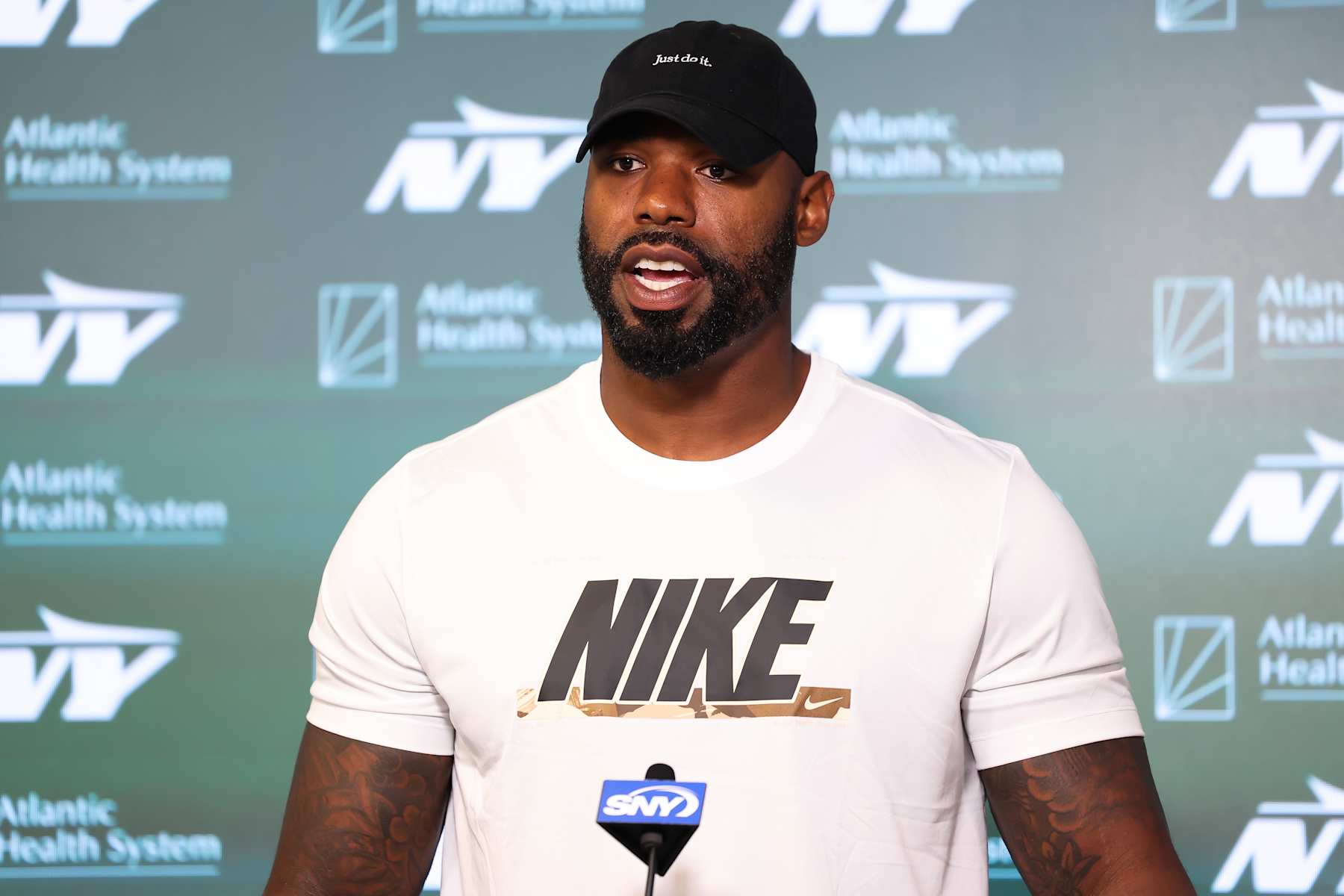 FLORHAM PARK, NEW JERSEY - JUNE 11: Tyron Smith #77 of the New York Jets speaks to the media during New York Jets Mandatory Minicamp at Atlantic Health Jets Training Center on June 11, 2024 in Florham Park, New Jersey. (Photo by Luke Hales/Getty Images)