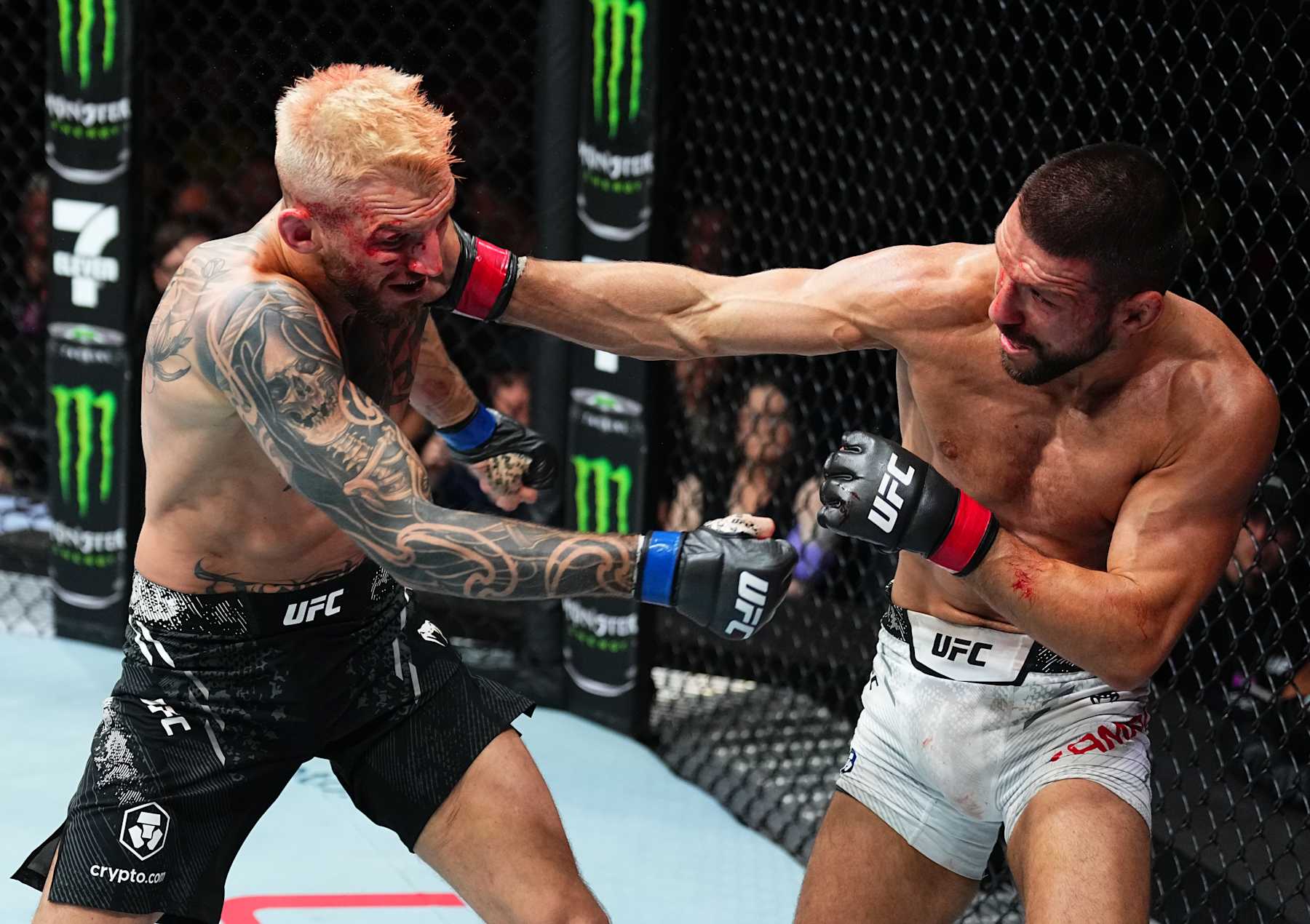 PERTH, AUSTRALIA - AUGUST 18: (R-L) Mateusz Gamrot of Poland punches Dan Hooker of New Zealand in a lightweight fight during the UFC 305 event at RAC Arena on August 18, 2024 in Perth, Australia. (Photo by Jeff Bottari/Zuffa LLC)