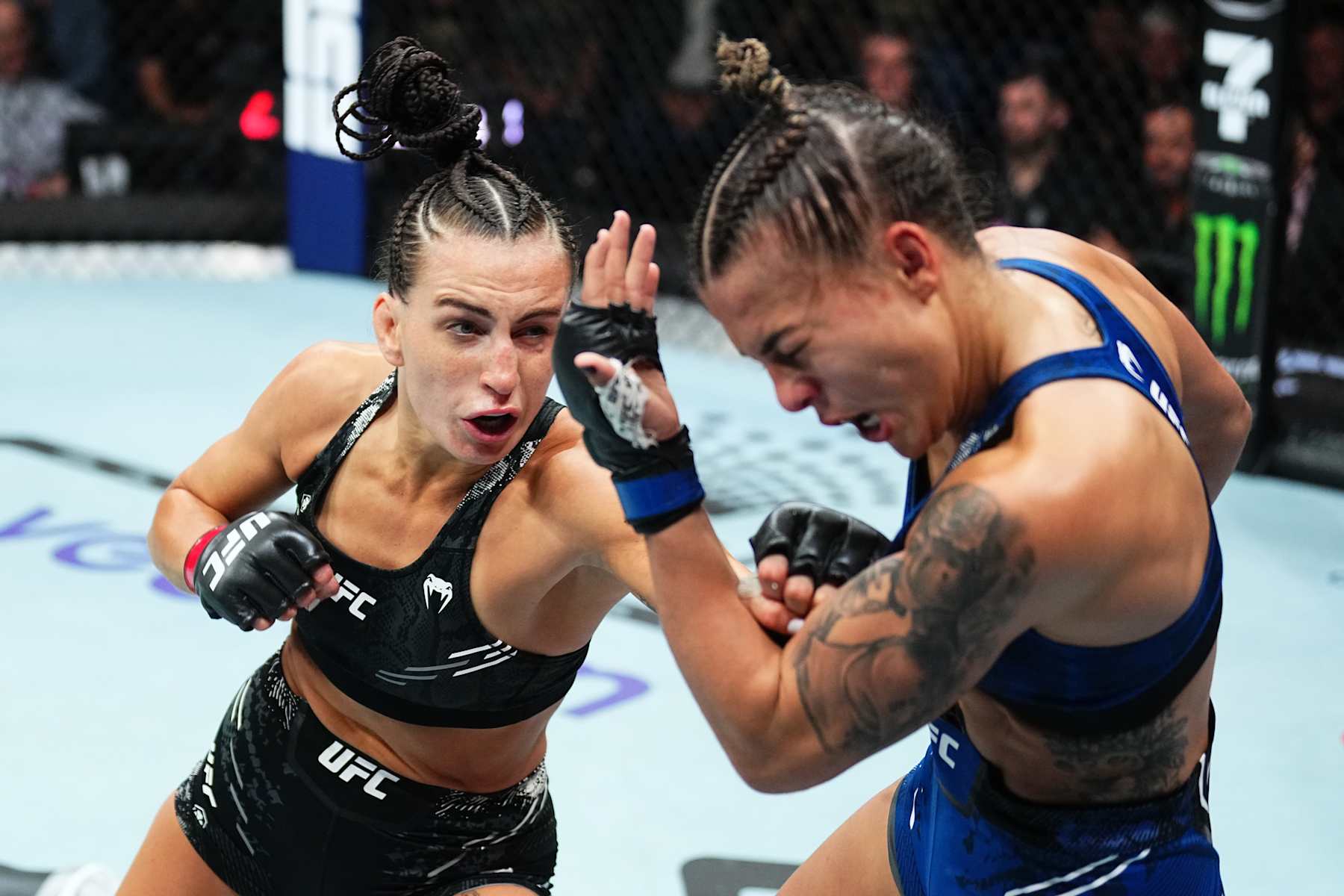 PERTH, AUSTRALIA - AUGUST 18: (L-R) Casey O'Neill of Scotland punches Luana Santos of Brazil in a flyweight fight during the UFC 305 event at RAC Arena on August 18, 2024 in Perth, Australia. (Photo by Jeff Bottari/Zuffa LLC)