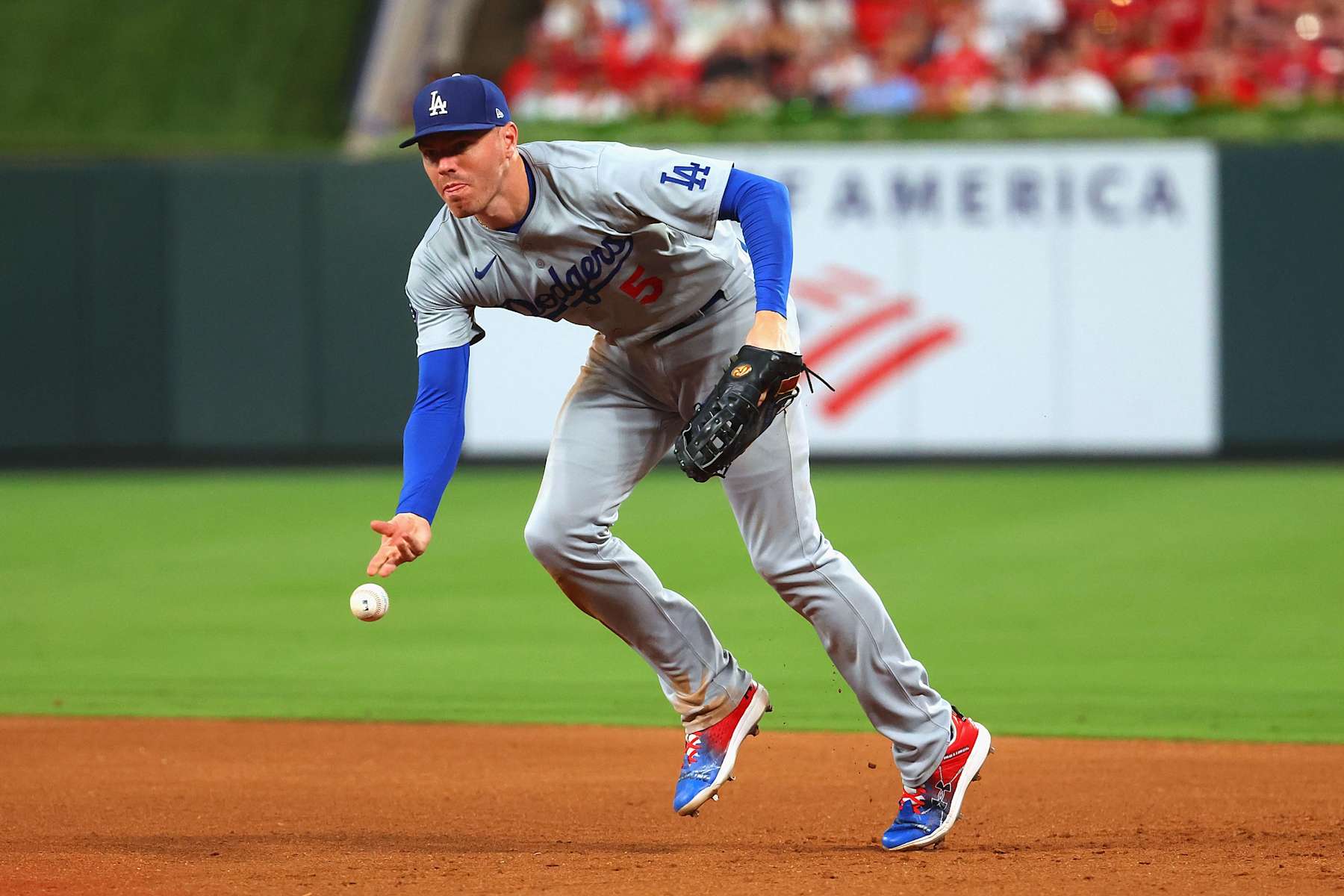 ST LOUIS, MISSOURI - AUGUST 17: Freddie Freeman #5 of the Los Angeles Dodgers flips the ball to first base against the St. Louis Cardinals in the fifth inning at Busch Stadium on August 17, 2024 in St Louis, Missouri. (Photo by Dilip Vishwanat/Getty Images)