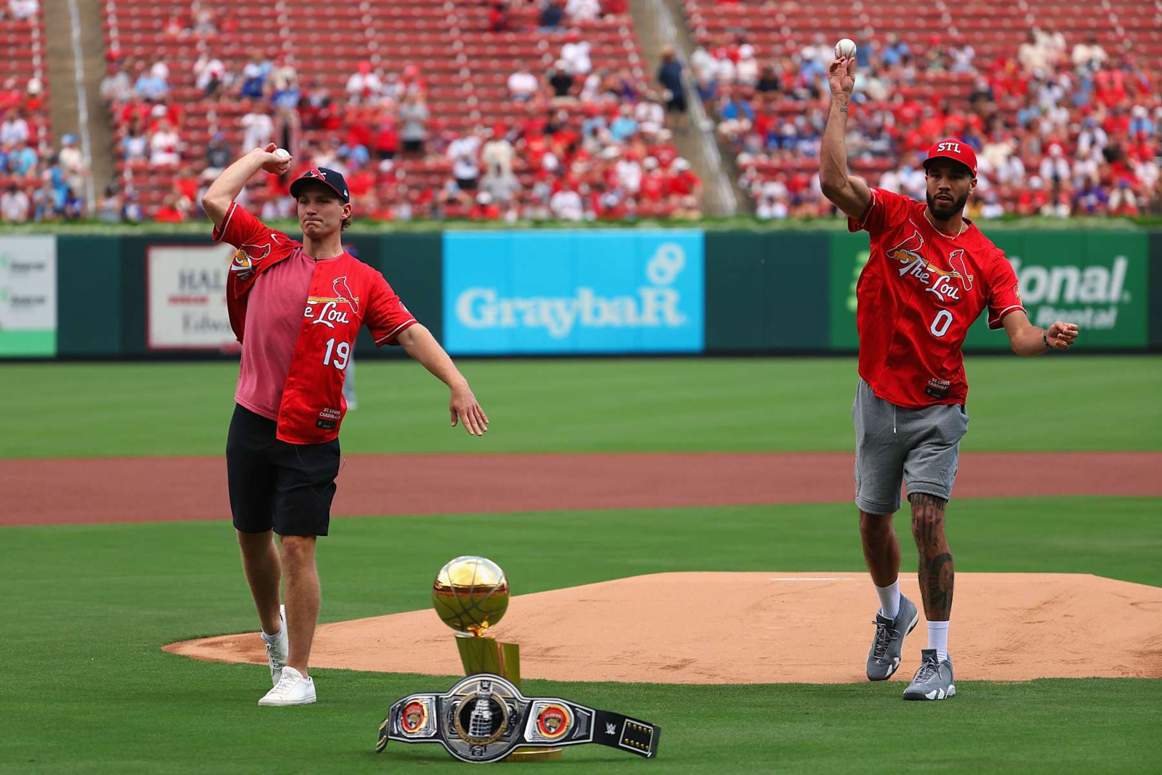 ST LOUIS, MISSOURI - AUGUST 18: St. Louis natives Stanley Cup Champion Matthew Tkachuk #19 of the Florida Panthers and NBL Finals Champion Jayson Tatum #0 of the Boston Celtics throw out the first pitches prior to a game between the St. Louis Cardinals and the Los Angeles Dodgers at Busch Stadium on August 18, 2024 in St Louis, Missouri. (Photo by Dilip Vishwanat/Getty Images)