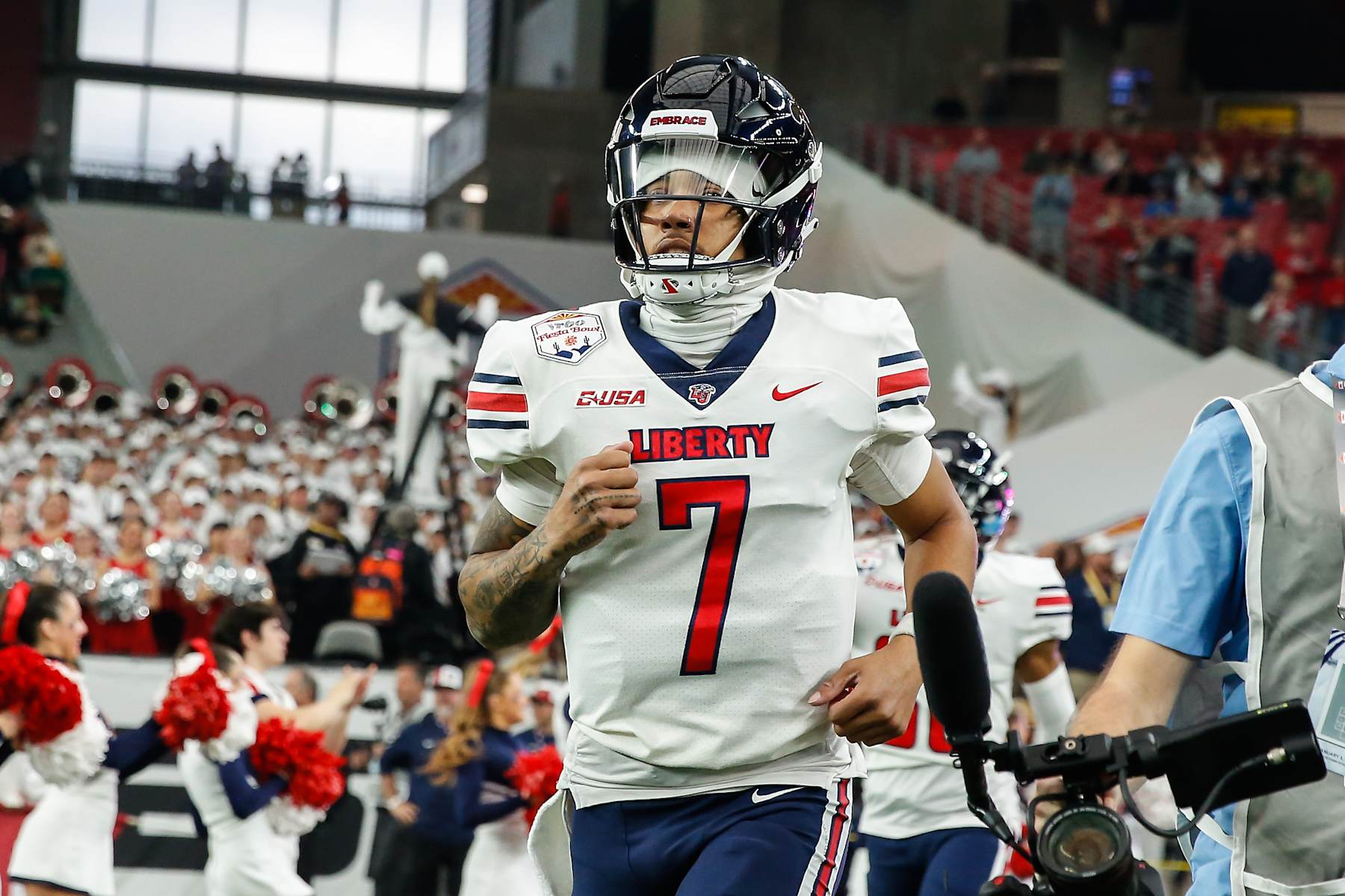 GLENDALE, AZ - JANUARY 01:  Liberty Flames quarterback Kaidon Salter (7) runs onto the field before the Vrbo Fiesta Bowl college football game between the Liberty Flames and the Oregon Ducks on January 1, 2024 at State Farm Stadium in Glendale, Arizona. (Photo by Kevin Abele/Icon Sportswire via Getty Images)