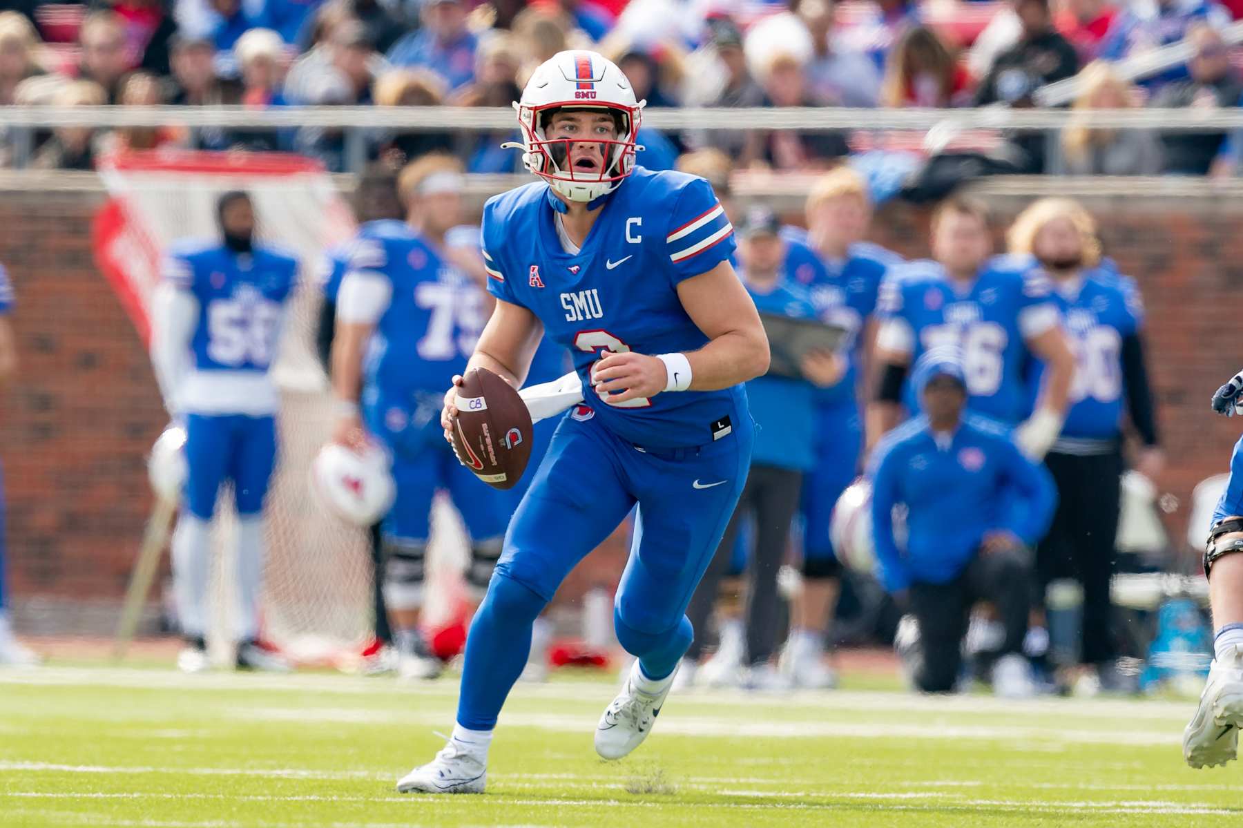 DALLAS, TX - NOVEMBER 25: Southern Methodist Mustangs quarterback Preston Stone (2) looks downfield to pass during a college football game between the Navy Midshipmen and Southern Methodist Mustangs on November 25, 2023 at Gerald Ford Stadium in Dallas, TX.  (Photo by Chris Leduc/Icon Sportswire via Getty Images)