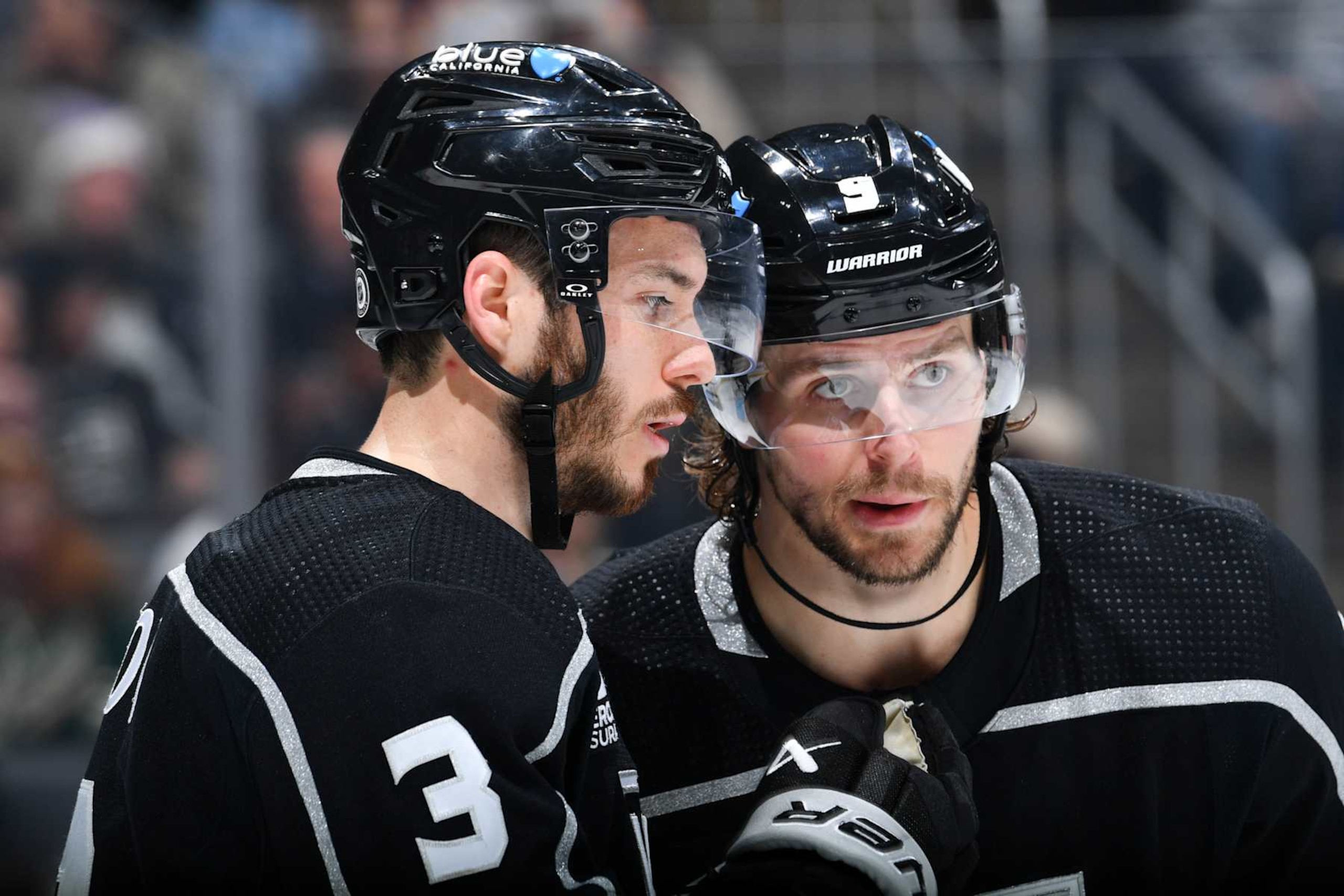 LOS ANGELES, CA - APRIL 15: Matt Roy #3 of the Los Angeles Kings and Adrian Kempe #9 meet on the ice during the second period against the Minnesota Wild at Crypto.com Arena on April 15, 2024 in Los Angeles, California. (Photo by Juan Ocampo/NHLI via Getty Images)