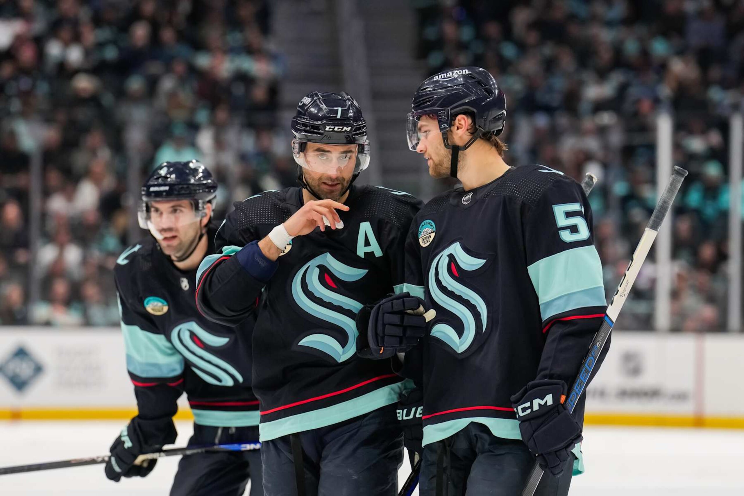 SEATTLE, WASHINGTON - APRIL 11: Jordan Eberle #7 talks with Shane Wright #51 of the Seattle Kraken during the third period of a game against the San Jose Sharks at Climate Pledge Arena on April 11, 2024 in Seattle, Washington. (Photo by Christopher Mast/NHLI via Getty Images)
