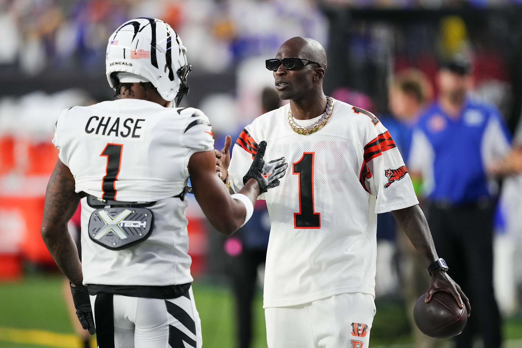 CINCINNATI, OHIO - SEPTEMBER 25: Ja'Marr Chase #1 of the Cincinnati Bengals meets with former Cincinnati Bengals player Chad Ochocinco Johnson before the game against the Los Angeles Rams at Paycor Stadium on September 25, 2023 in Cincinnati, Ohio. (Photo by Dylan Buell/Getty Images)