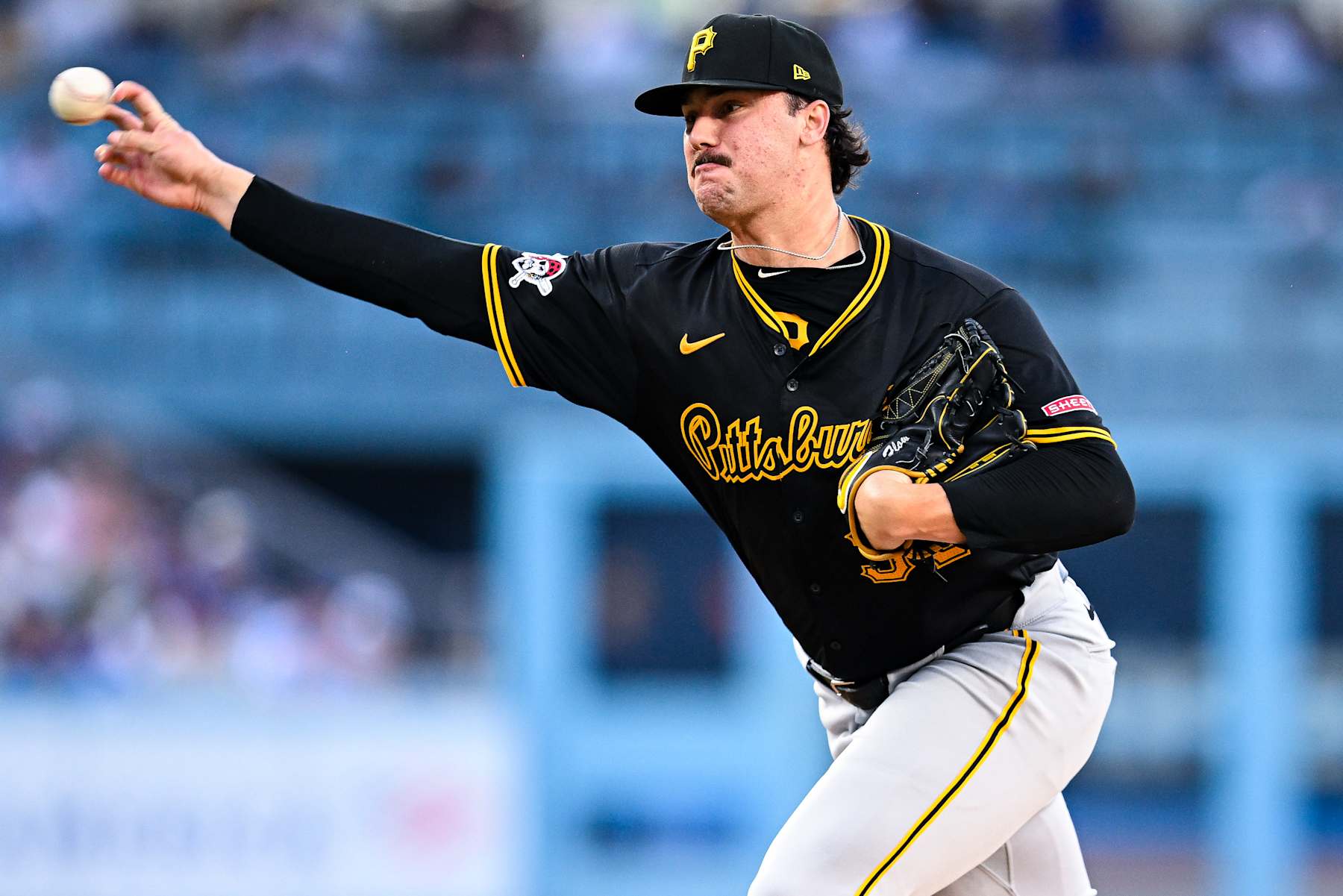 LOS ANGELES, CALIFORNIA - AUGUST 10: Paul Skenes #30 pitches in the bottom of the second inning during the regular season game against the Los Angeles Dodgers at Dodger Stadium on August 10, 2024 in Los Angeles, California. (Photo by Gene Wang/Getty Images)