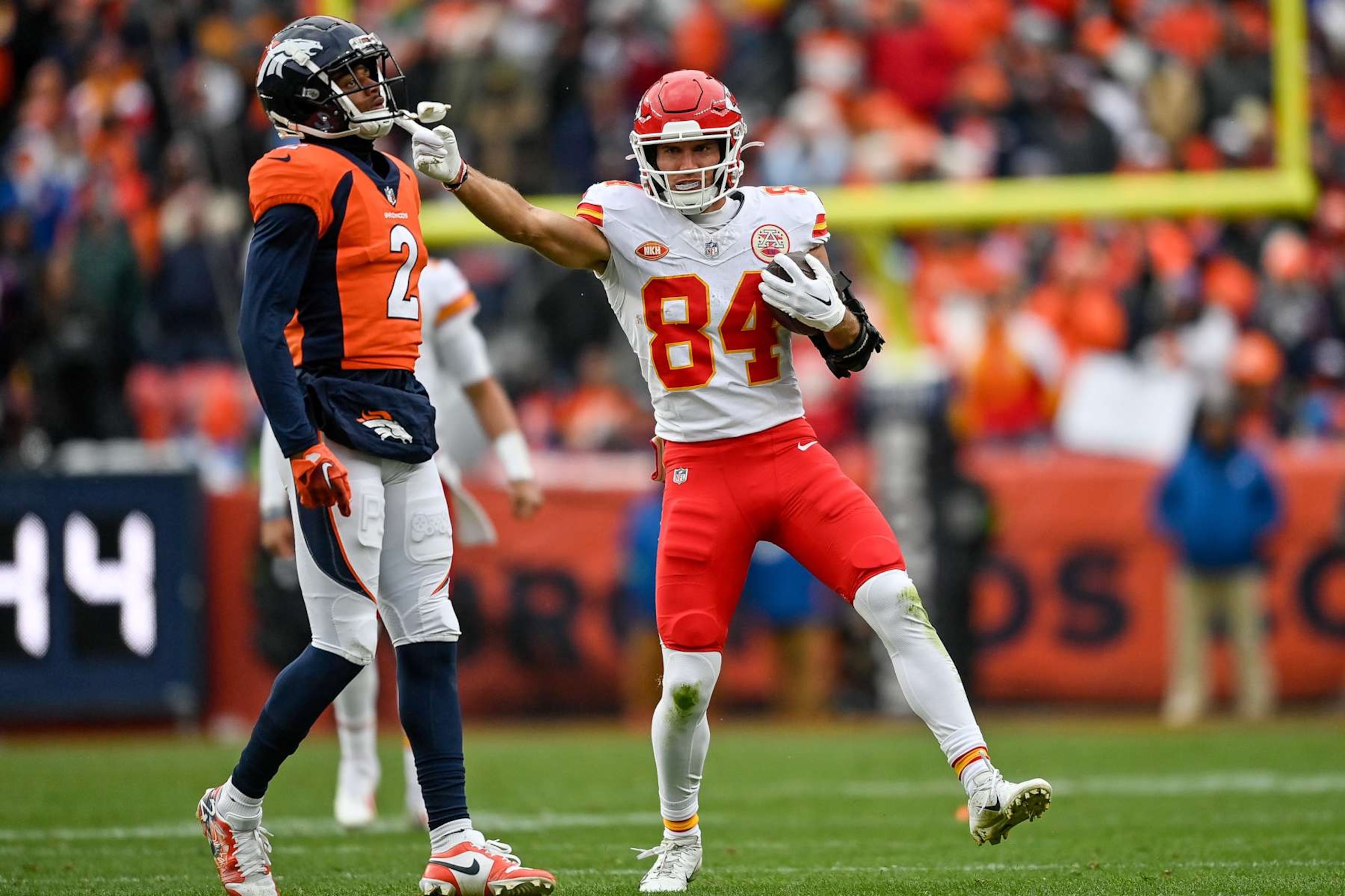 DENVER, CO - OCTOBER 29: Kansas City Chiefs wide receiver Justin Watson (84) celebrates after a first down catch as Denver Broncos cornerback Pat Surtain II (2) looks on at Empower Field at Mile High on October 29, 2023 in Denver, Colorado. (Photo by Dustin Bradford/Icon Sportswire via Getty Images)