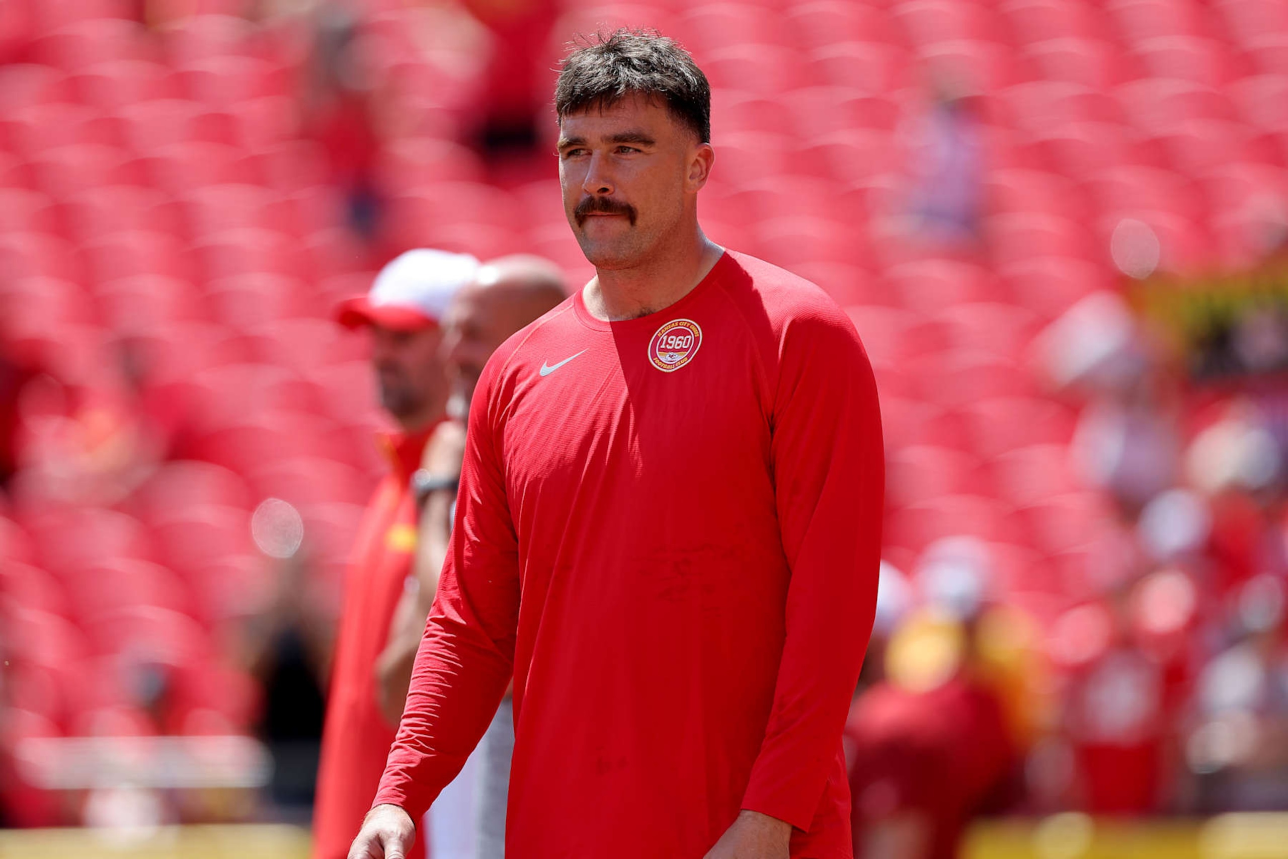 KANSAS CITY, MISSOURI - AUGUST 17: Travis Kelce #87 of the Kansas City Chiefs walks between plays during pregame warmups prior to a preseason game against the Detroit Lions at GEHA Field at Arrowhead Stadium on August 17, 2024 in Kansas City, Missouri. (Photo by David Eulitt/Getty Images)