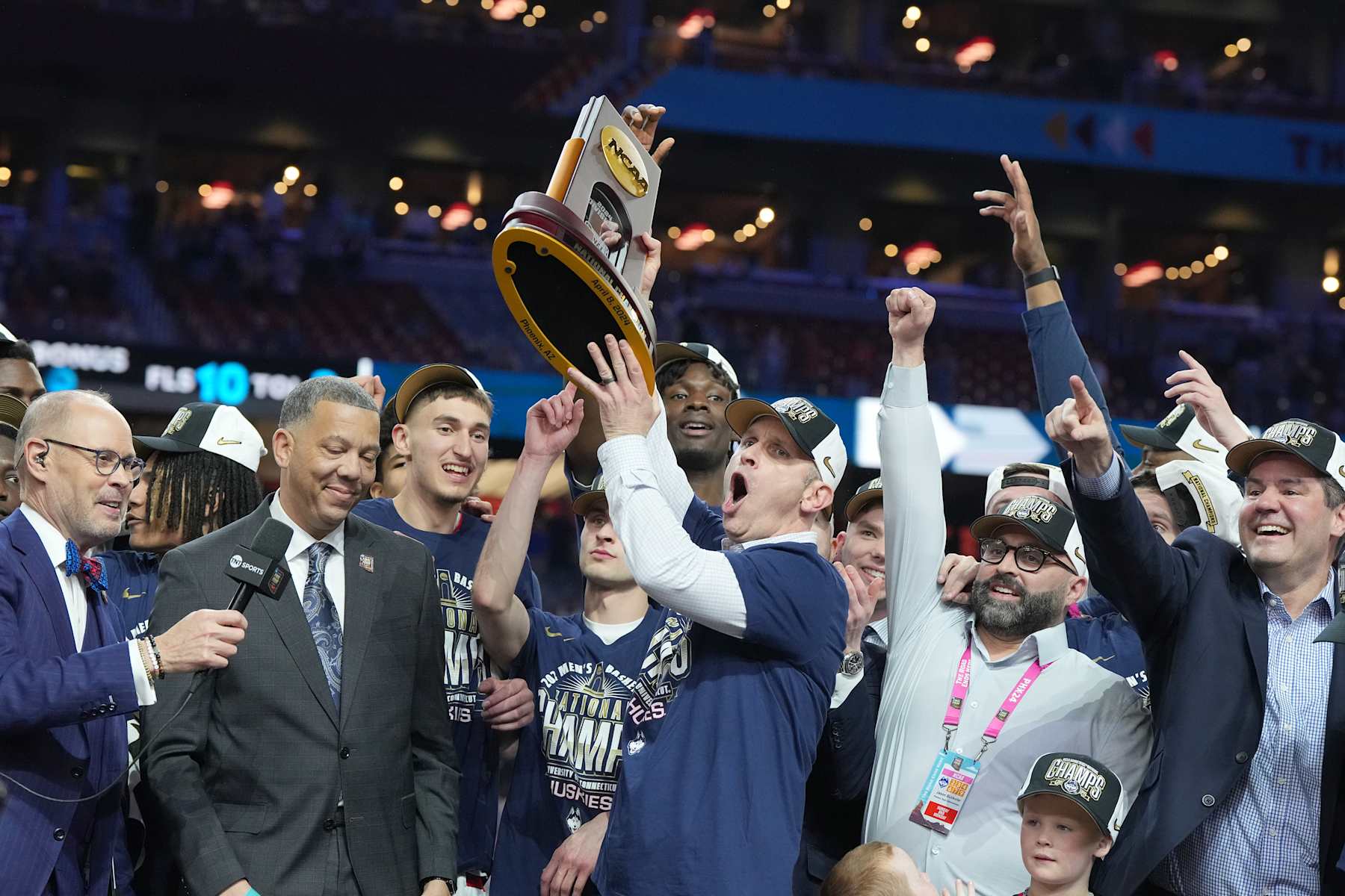 GLENDALE, ARIZONA - APRIL 08:  Head coach Dan Hurley and the Connecticut Huskies celebrates after the National College Basketball Championship game against the Purdue Boilermakers at State Farm Stadium on April 08, 2024 in Glendale, Arizona.  (Photo by Mitchell Layton/Getty Images)