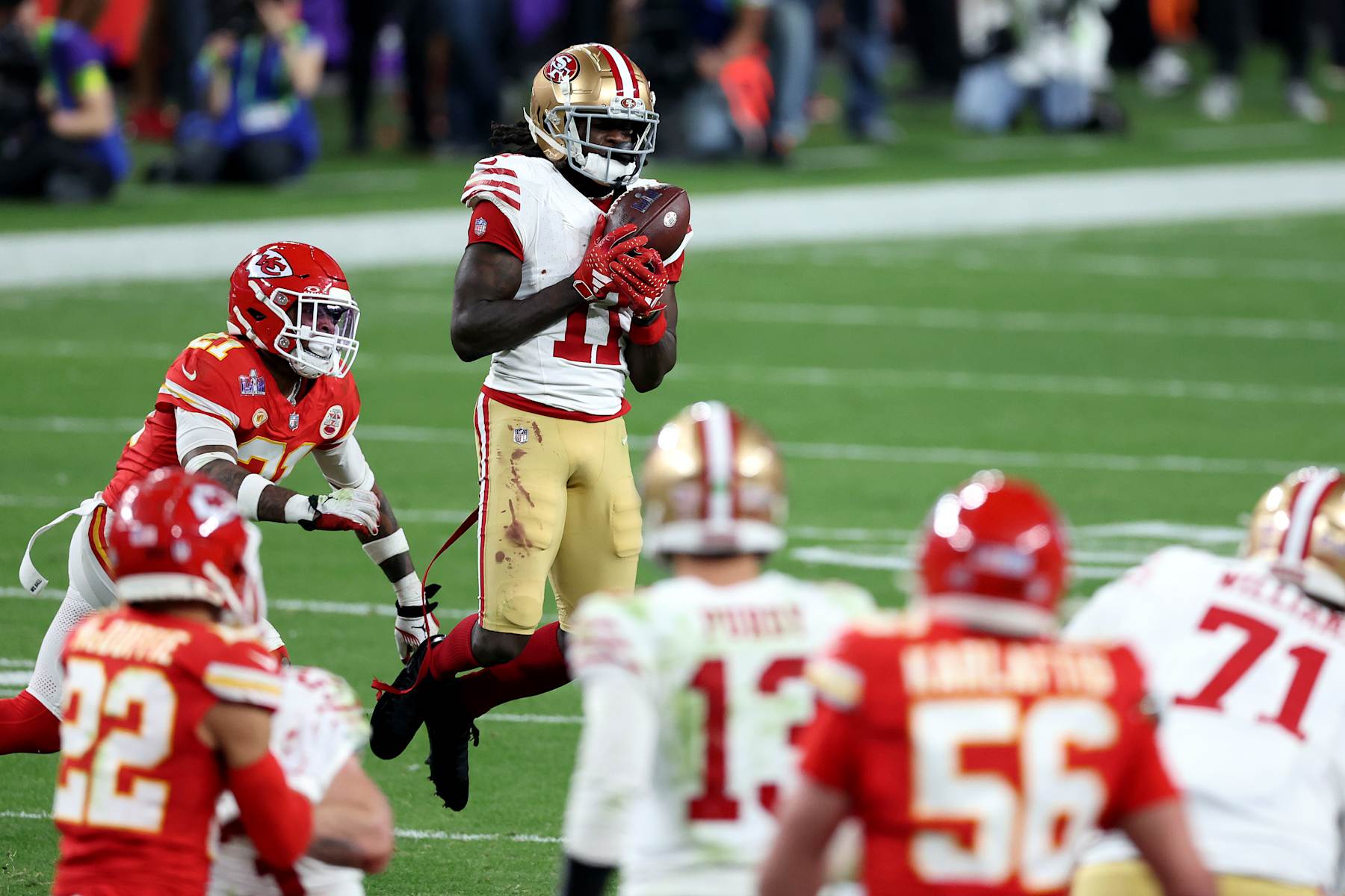 LAS VEGAS, NEVADA - FEBRUARY 11: Brandon Aiyuk #11 of the San Francisco 49ers catches a pass for a first down in overtime against the Kansas City Chiefs during Super Bowl LVIII at Allegiant Stadium on February 11, 2024 in Las Vegas, Nevada. (Photo by Steph Chambers/Getty Images)