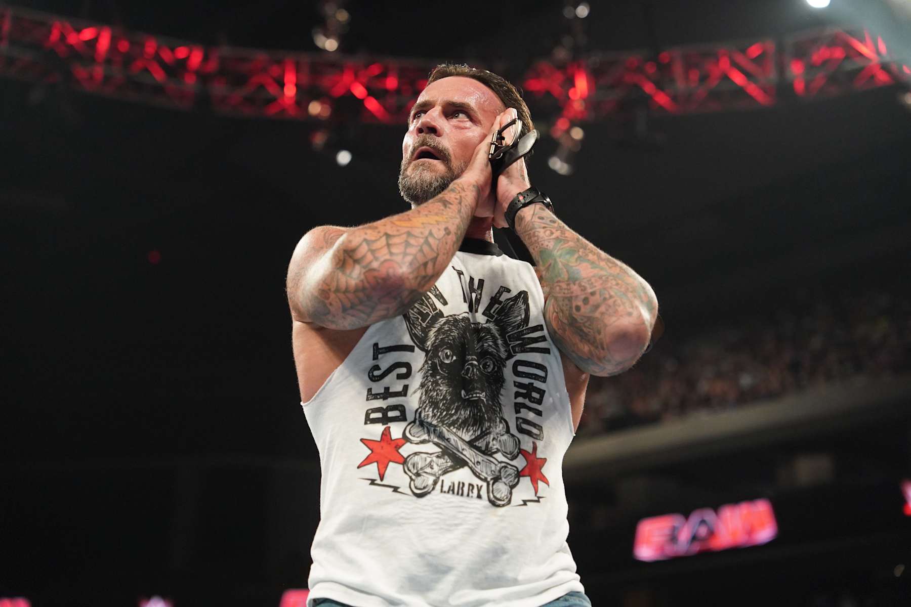 AUSTIN, TEXAS - AUGUST 12: CM Punk teases a GTS during Monday Night RAW at Moody Center on August 12, 2024 in Austin, Texas.  (Photo by WWE/Getty Images)