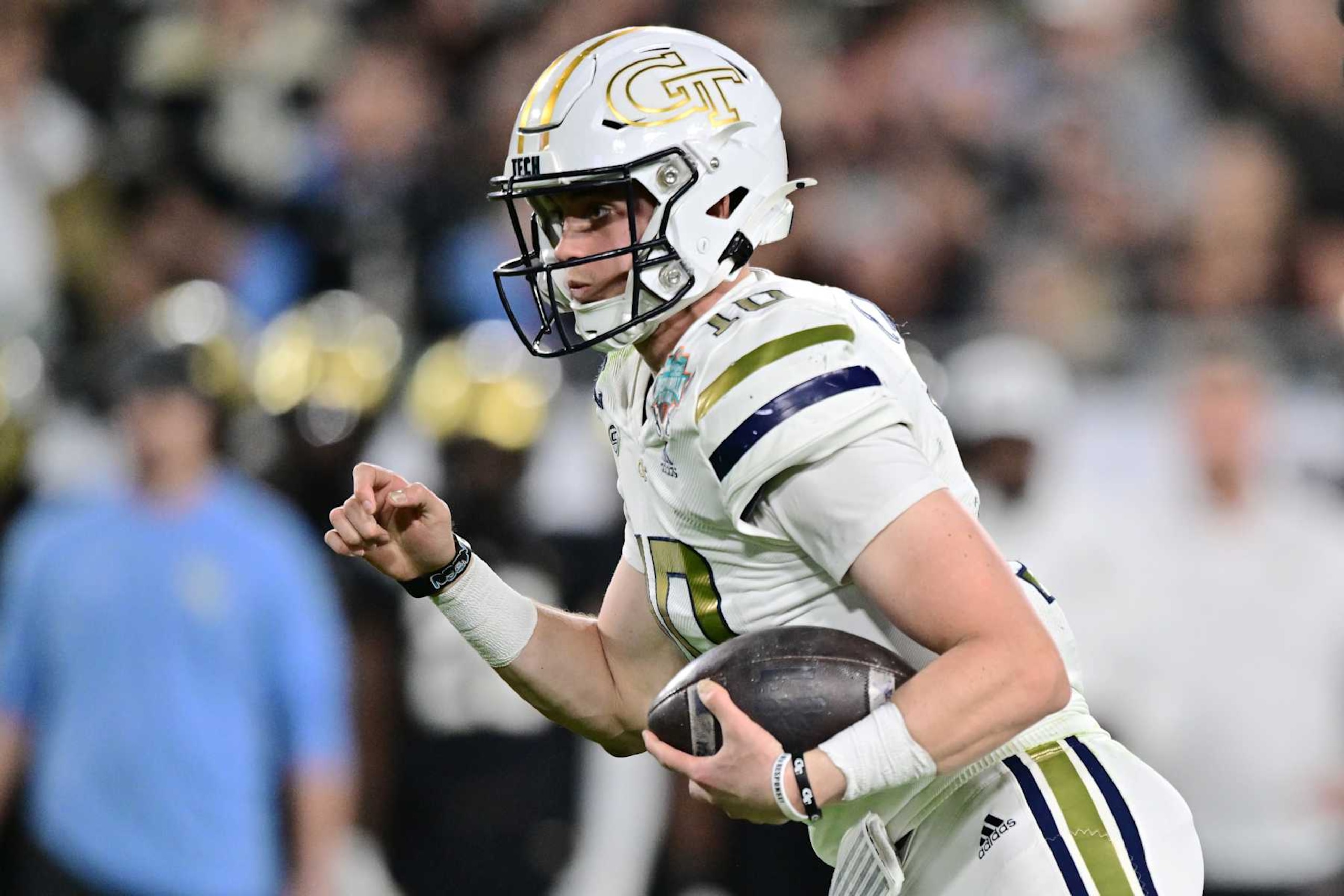 TAMPA, FLORIDA - DECEMBER 22: Haynes King #10 of the Georgia Tech Yellow Jackets runs the ball in the second quarter against the UCF Knights during the 2023 Union Home Mortgage Gasparilla Bowl at Raymond James Stadium on December 22, 2023 in Tampa, Florida. (Photo by Julio Aguilar/Getty Images)