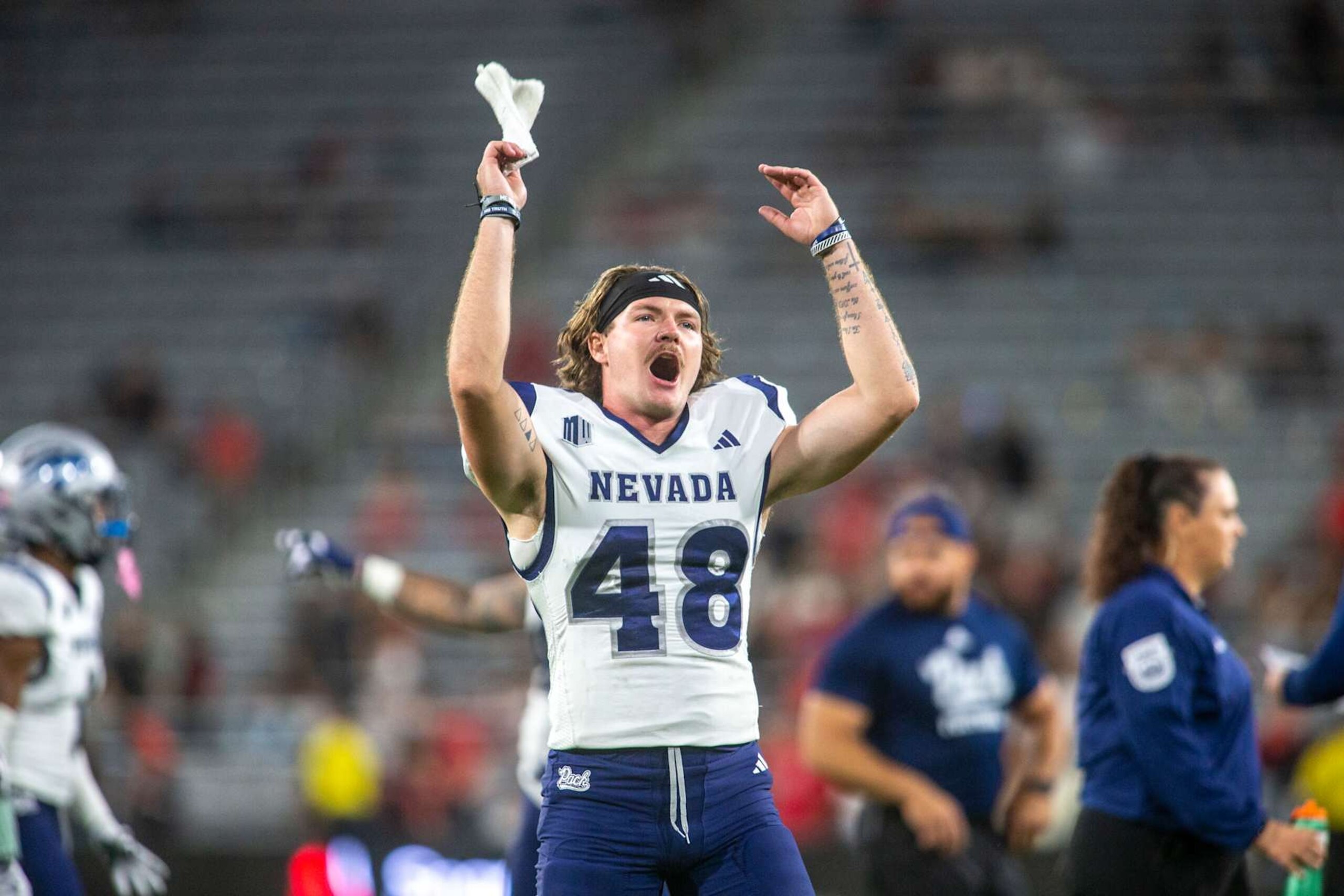 SAN DIEGO, CA - OCTOBER 21: Nevada punter Matt Freem (48) cheers on fans in the stands from the sideline in the second half of a college football game between the Nevada Wolf Pack and the San Diego State Aztecs on October 21, 2023, at Snapdragon Stadium in San Diego, California. (Photo by Tony Ding/Icon Sportswire via Getty Images)