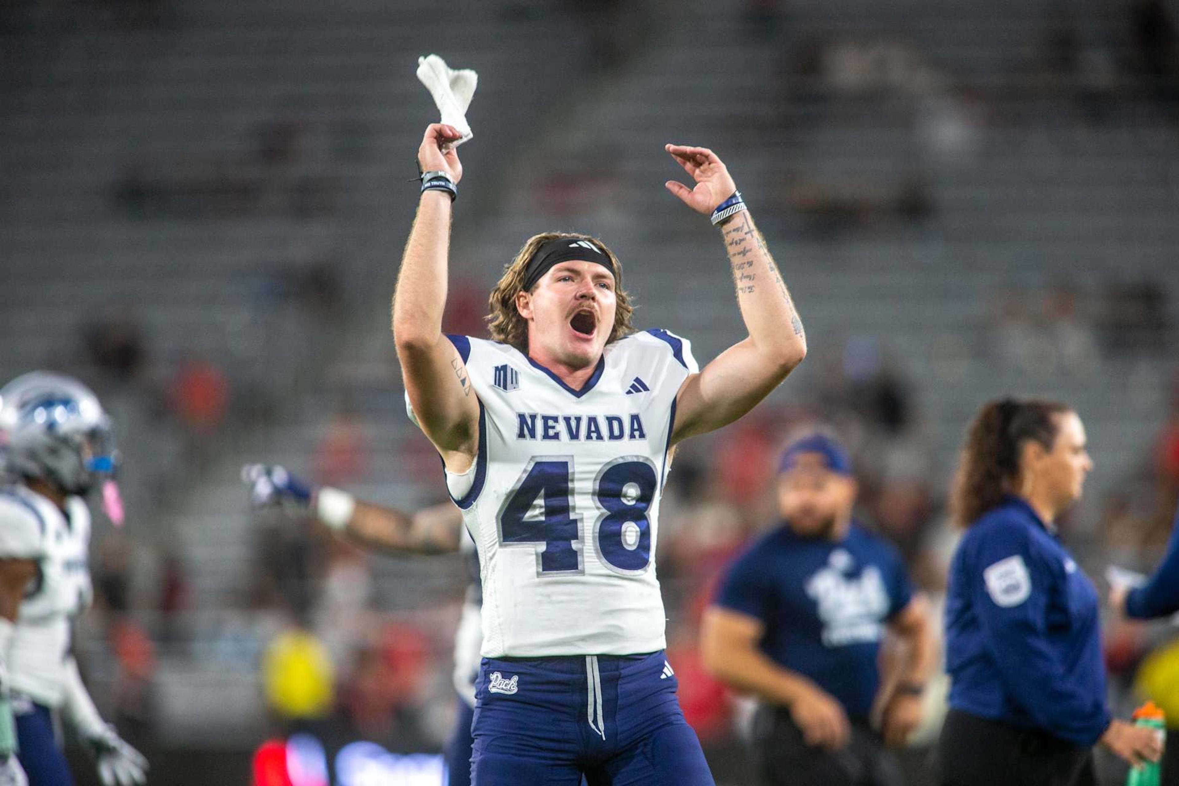 SAN DIEGO, CA - OCTOBER 21: Nevada punter Matt Freem (48) cheers on fans in the stands from the sideline in the second half of a college football game between the Nevada Wolf Pack and the San Diego State Aztecs on October 21, 2023, at Snapdragon Stadium in San Diego, California. (Photo by Tony Ding/Icon Sportswire via Getty Images)