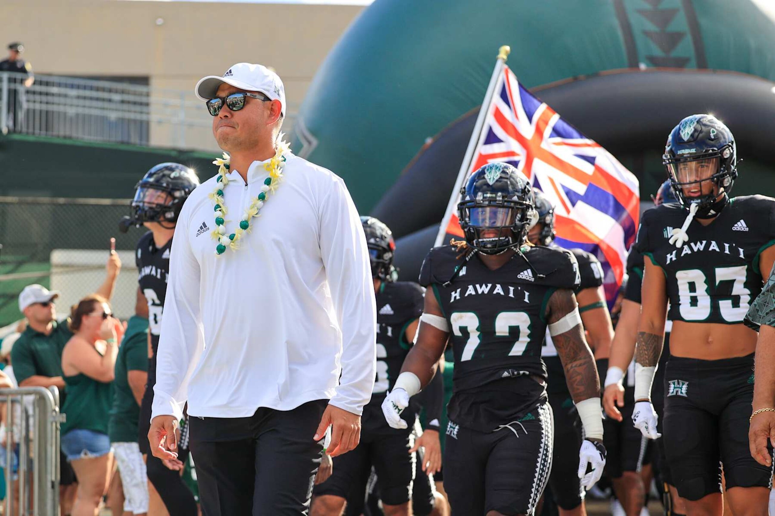 HONOLULU, HI - AUGUST 27: Head coach Timmy Chang of the Hawaii Rainbow Warriors leads his team out of the locker room before the NCAA football game against the Vanderbilt Commodores at the Clarance T.C. Ching Athletic Complex on August 27, 2022 in Honolulu, Hawaii. (Photo by Darryl Oumi/Getty Images)