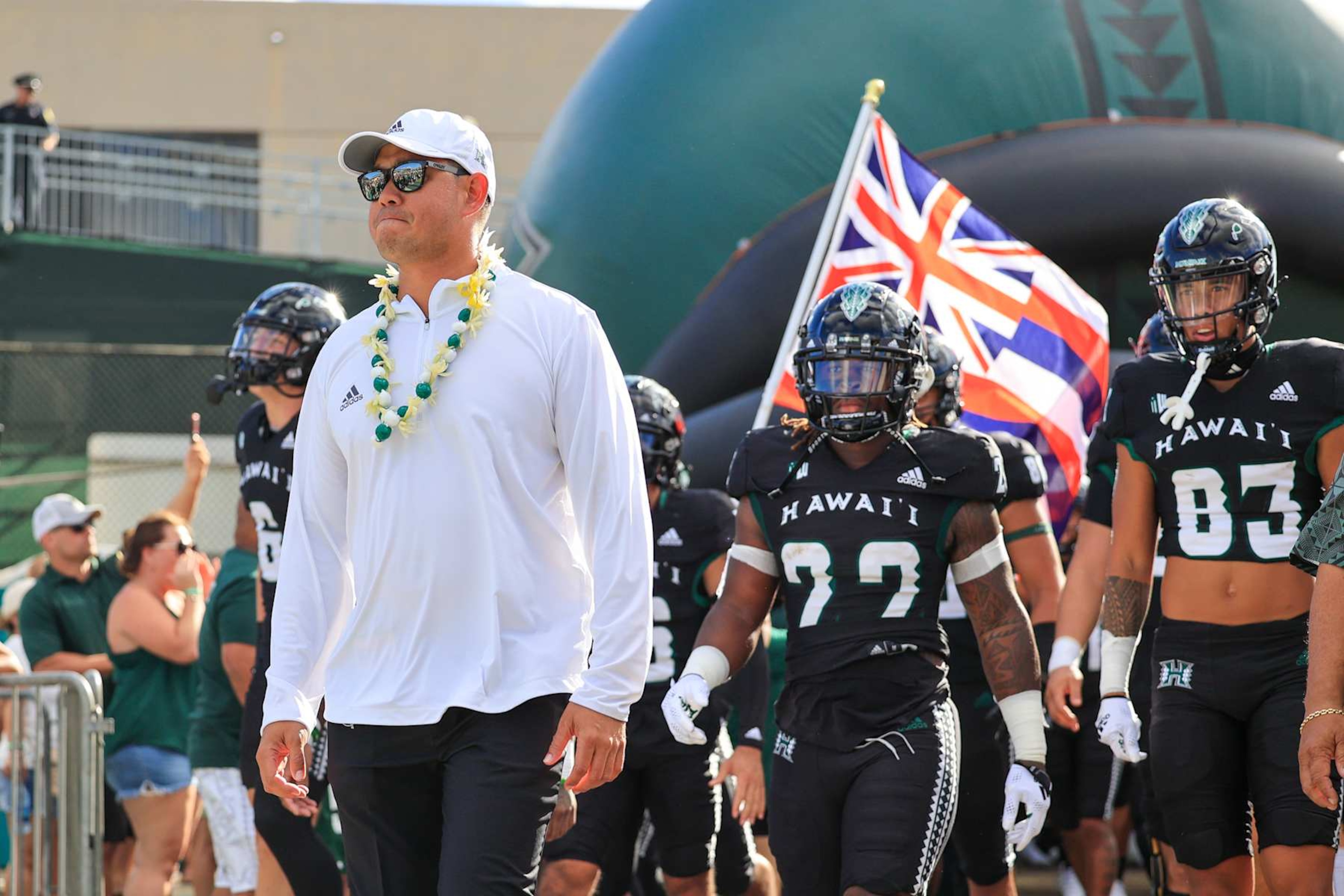 HONOLULU, HI - AUGUST 27: Head coach Timmy Chang of the Hawaii Rainbow Warriors leads his team out of the locker room before the NCAA football game against the Vanderbilt Commodores at the Clarance T.C. Ching Athletic Complex on August 27, 2022 in Honolulu, Hawaii. (Photo by Darryl Oumi/Getty Images)