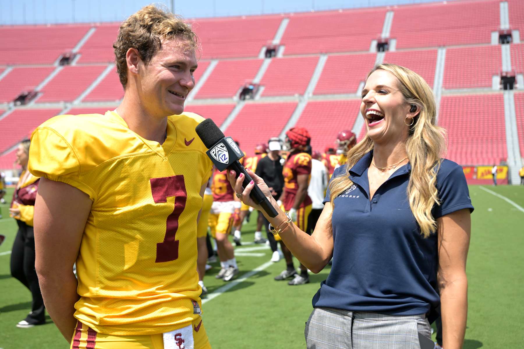 LOS ANGELES, CALIFORNIA - APRIL 20:  Pac-12 Network reporter Ashley Adamson interviews Miller Moss #7 of the USC Trojans following the Spring football game at United Airlines Field at the Los Angeles Memorial Coliseum on April 20, 2024 in Los Angeles, California. (Photo by Jayne Kamin-Oncea/Getty Images)