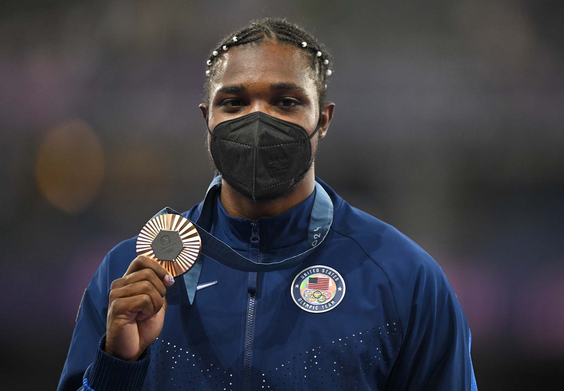 Paris , France - 9 August 2024; Noah Lyles of Team USA celebrates with his men's 200m bronze medal at the Stade de France during the 2024 Paris Summer Olympic Games in Paris, France. (Photo By Brendan Moran/Sportsfile via Getty Images)