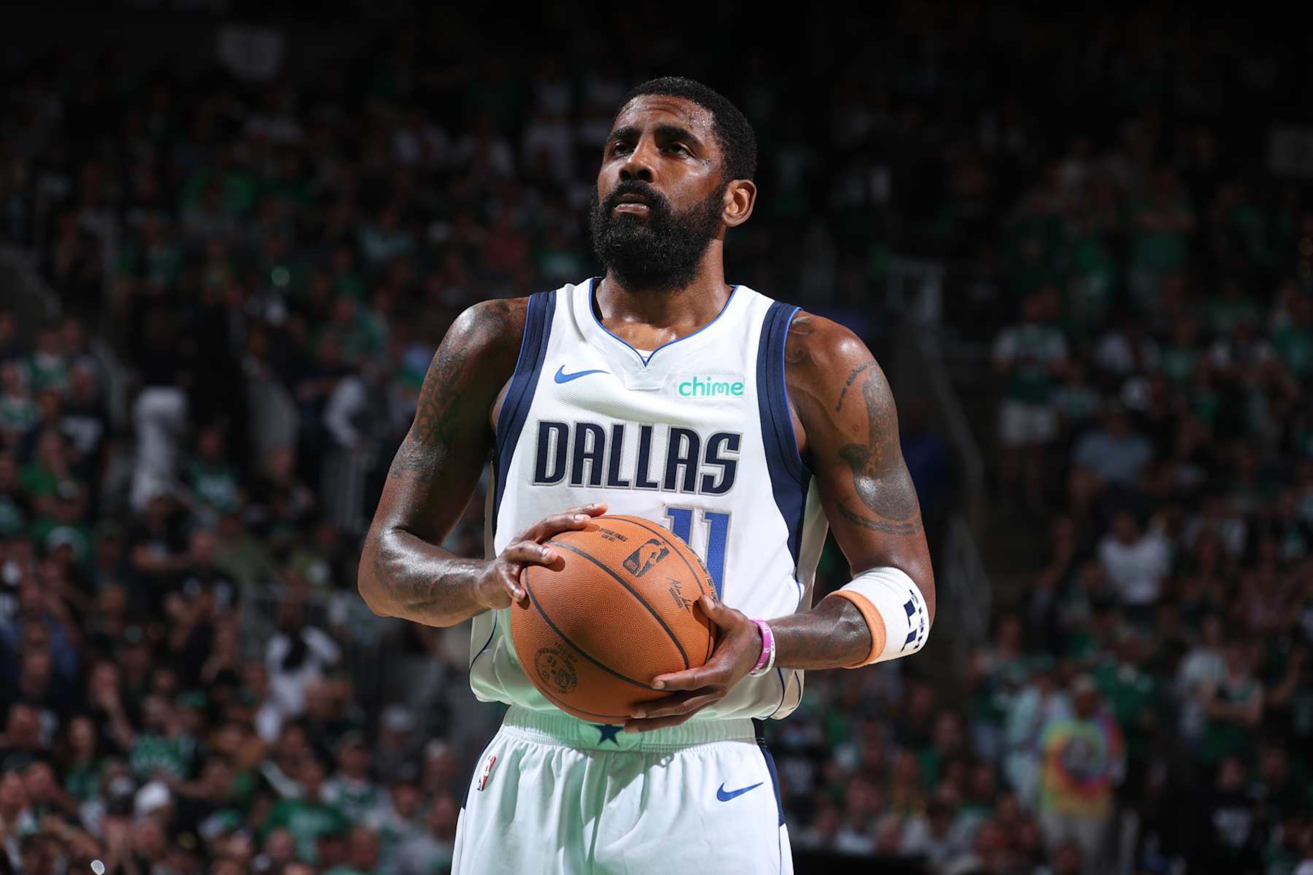 BOSTON, MA - JUNE 17: Kyrie Irving #11 of the Dallas Mavericks shoots a free throw during the game against the Boston Celtics during Game 5 of the 2024 NBA Finals on June 17, 2024 at the TD Garden in Boston, Massachusetts. NOTE TO USER: User expressly acknowledges and agrees that, by downloading and or using this photograph, User is consenting to the terms and conditions of the Getty Images License Agreement. Mandatory Copyright Notice: Copyright 2024 NBAE  (Photo by Nathaniel S. Butler/NBAE via Getty Images)