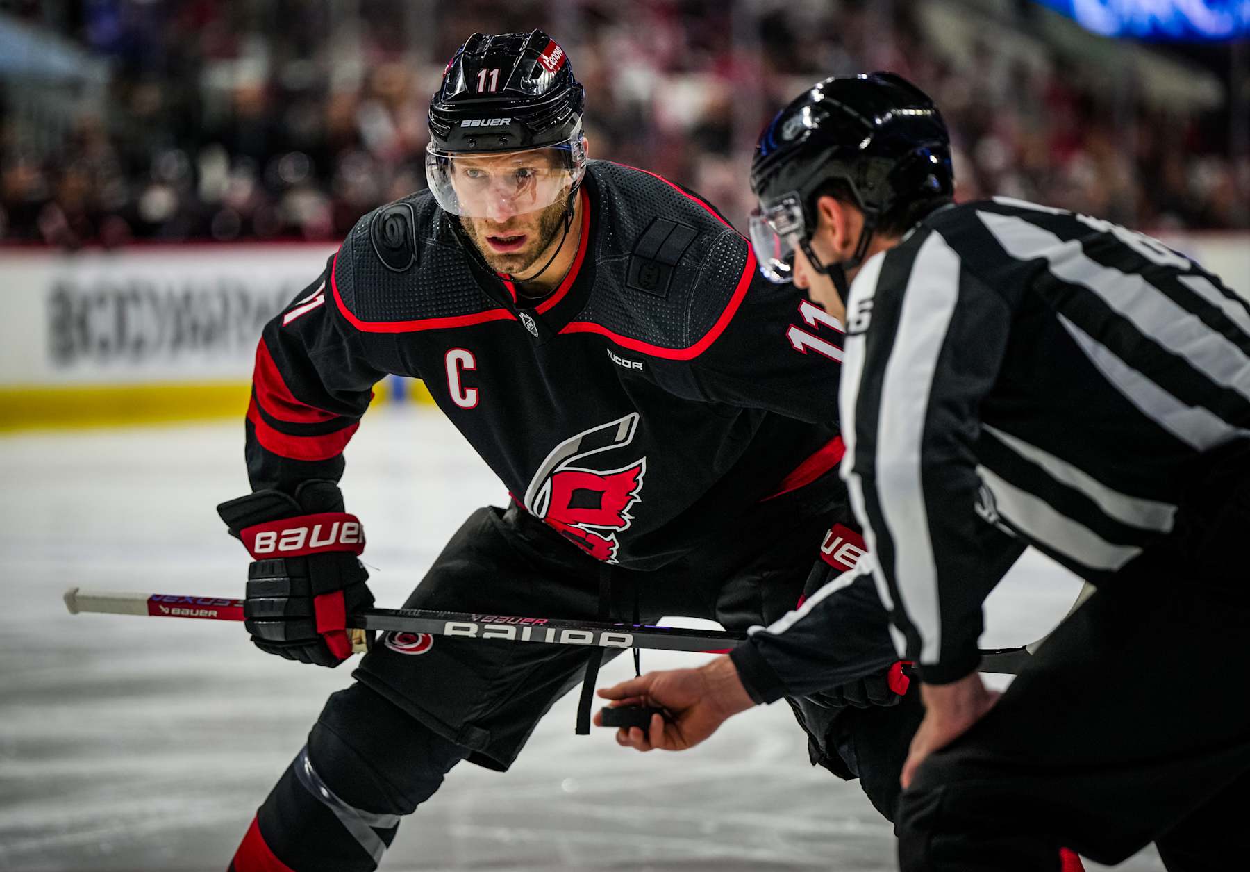 RALEIGH, NORTH CAROLINA - APRIL 22:  Jordan Staal #11 of the Carolina Hurricanes prepares for a face off during the first period against the New York Islanders in Game Two of the First Round of the 2024 Stanley Cup Playoffs at PNC Arena on April 22, 2024 in Raleigh, North Carolina. (Photo by Josh Lavallee/NHLI via Getty Images)