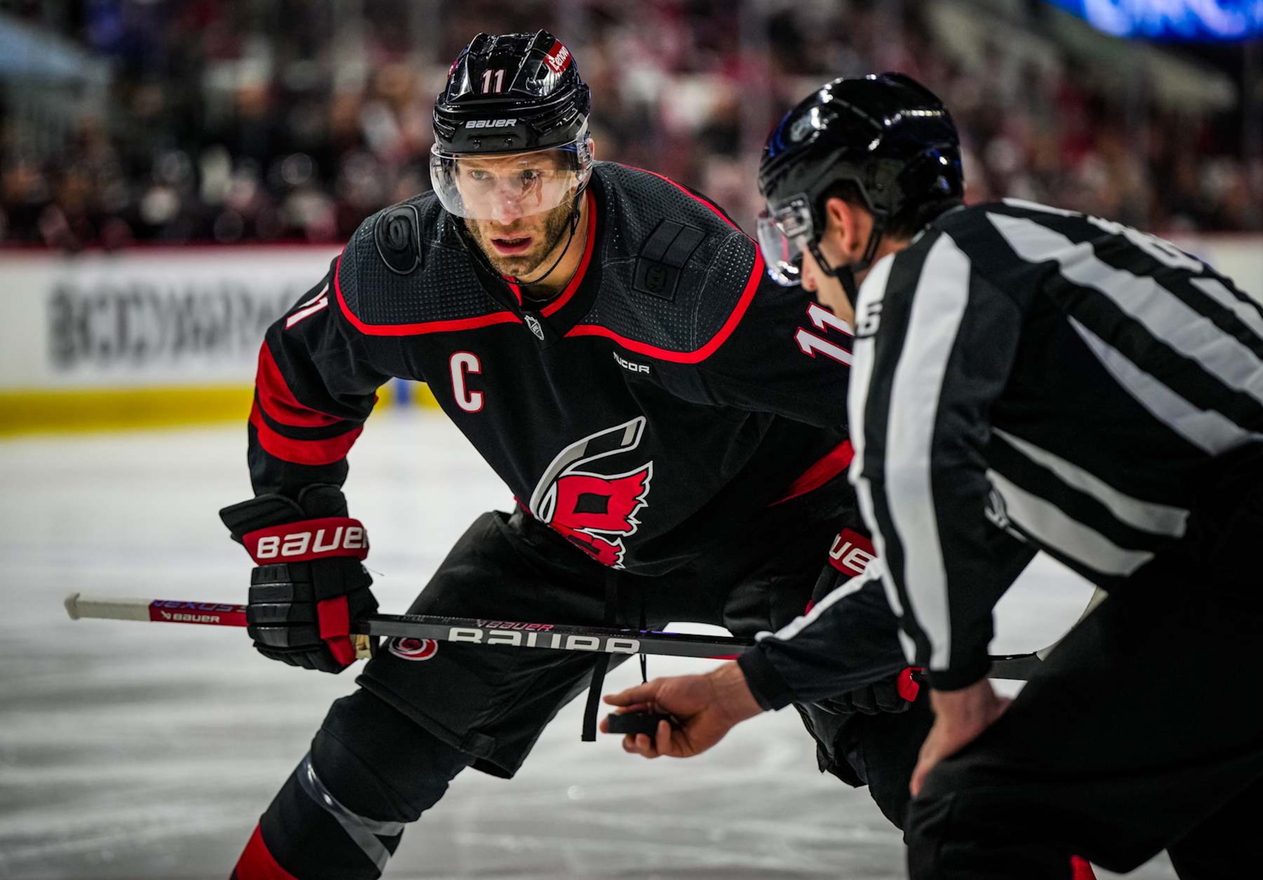 RALEIGH, NORTH CAROLINA - APRIL 22:  Jordan Staal #11 of the Carolina Hurricanes prepares for a face off during the first period against the New York Islanders in Game Two of the First Round of the 2024 Stanley Cup Playoffs at PNC Arena on April 22, 2024 in Raleigh, North Carolina. (Photo by Josh Lavallee/NHLI via Getty Images)