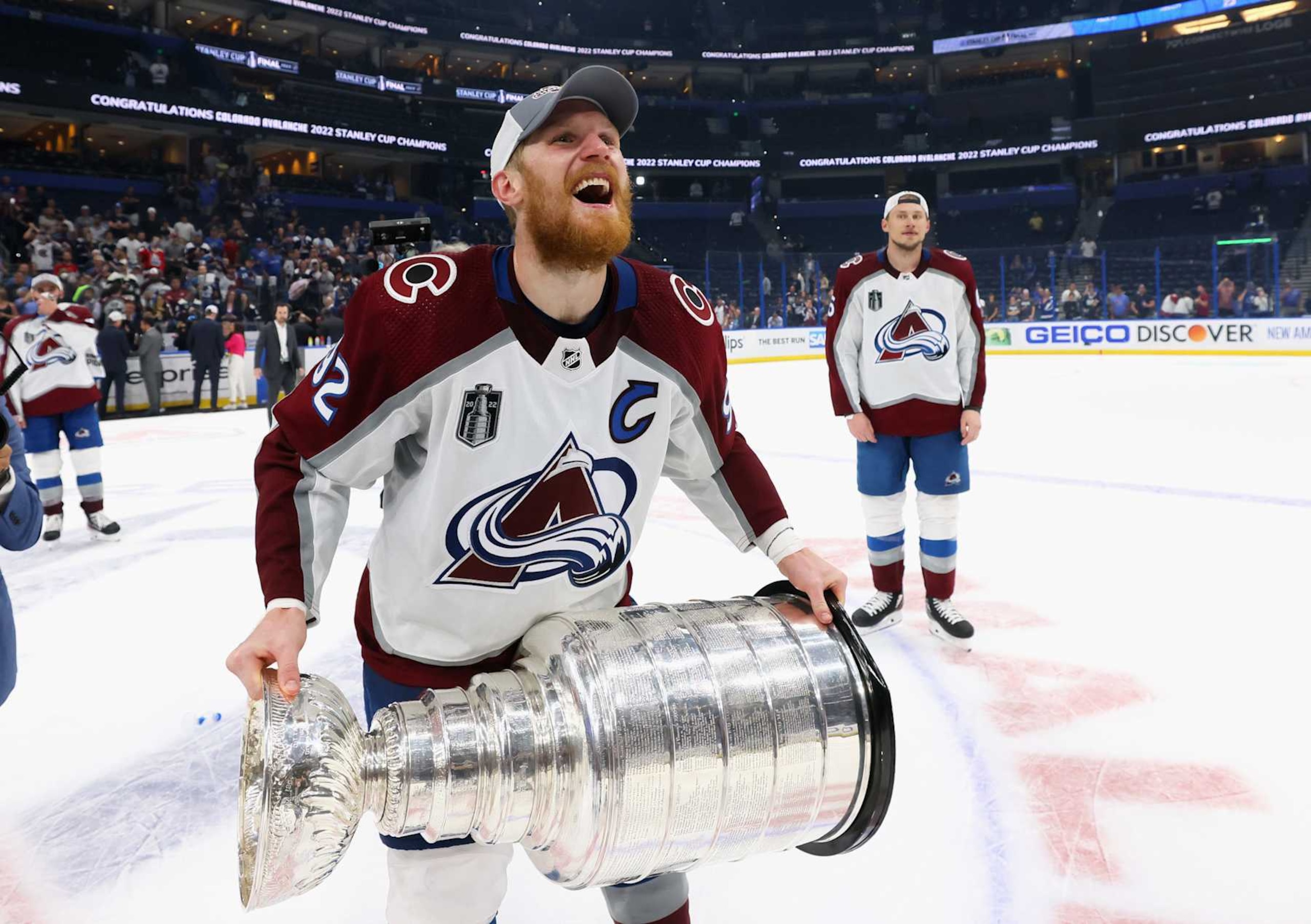 TAMPA, FLORIDA - JUNE 26: Gabriel Landeskog #92 of the Colorado Avalanche carries the Stanley Cup following the series winning victory over the Tampa Bay Lightning in Game Six of the 2022 NHL Stanley Cup Final at Amalie Arena on June 26, 2022 in Tampa, Florida. (Photo by Bruce Bennett/Getty Images)