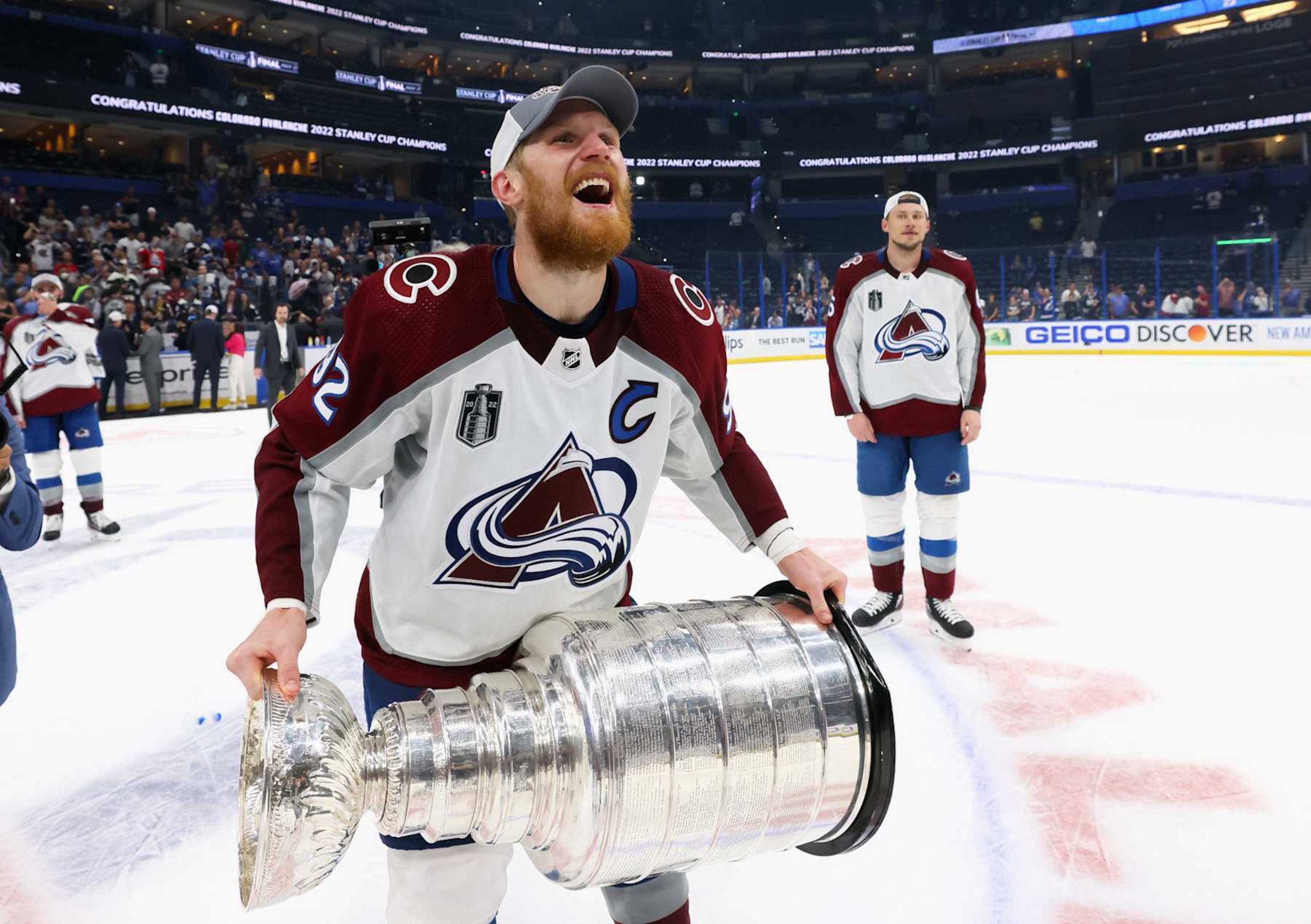 TAMPA, FLORIDA - JUNE 26: Gabriel Landeskog #92 of the Colorado Avalanche carries the Stanley Cup following the series winning victory over the Tampa Bay Lightning in Game Six of the 2022 NHL Stanley Cup Final at Amalie Arena on June 26, 2022 in Tampa, Florida. (Photo by Bruce Bennett/Getty Images)