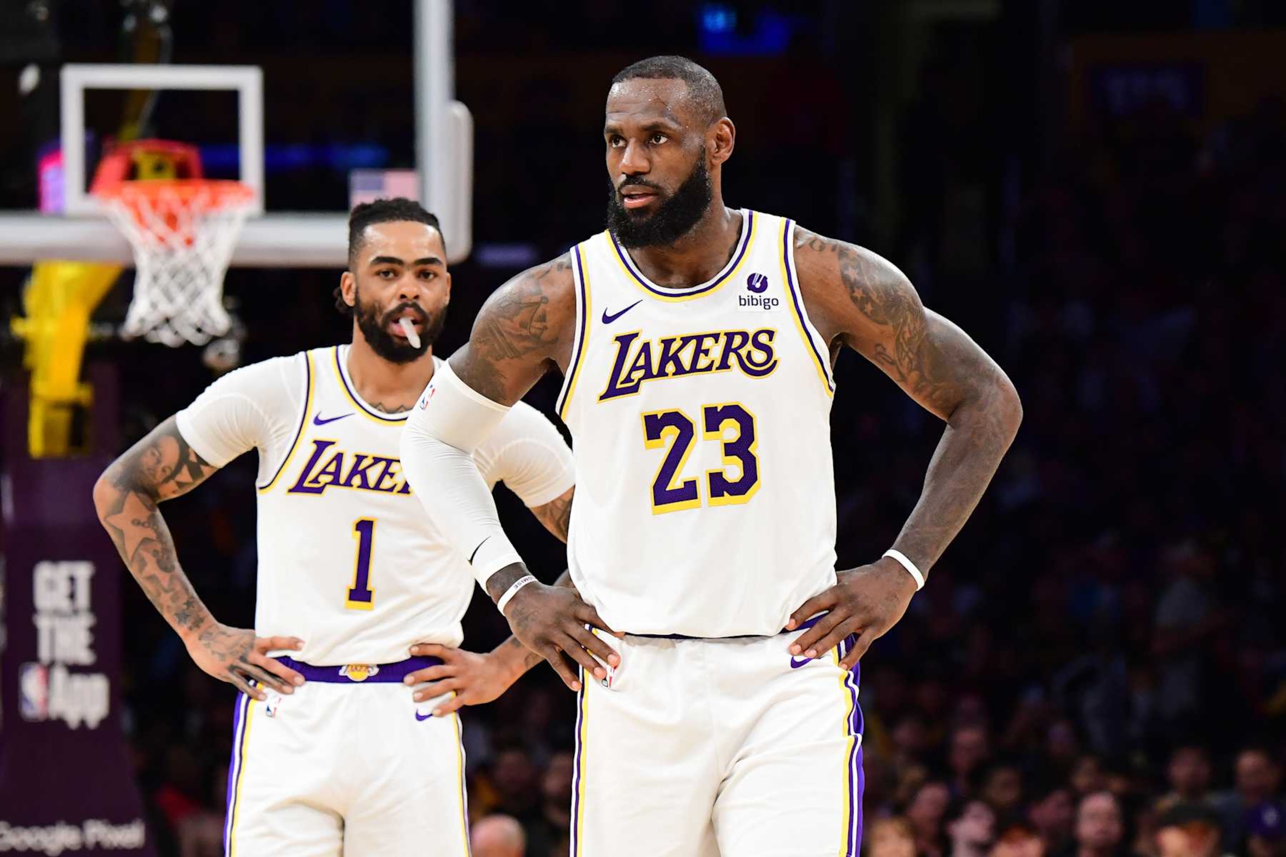 LOS ANGELES, CA - APRIL 27: LeBron James #23 and D'Angelo Russell #1 of the Los Angeles Lakers look on during the game against the Denver Nuggets during Round 1 Game 4 of the 2024 NBA Playoffs on April 27, 2024 at Crypto.Com Arena in Los Angeles, California. NOTE TO USER: User expressly acknowledges and agrees that, by downloading and/or using this Photograph, user is consenting to the terms and conditions of the Getty Images License Agreement. Mandatory Copyright Notice: Copyright 2024 NBAE (Photo by Adam Pantozzi/NBAE via Getty Images)