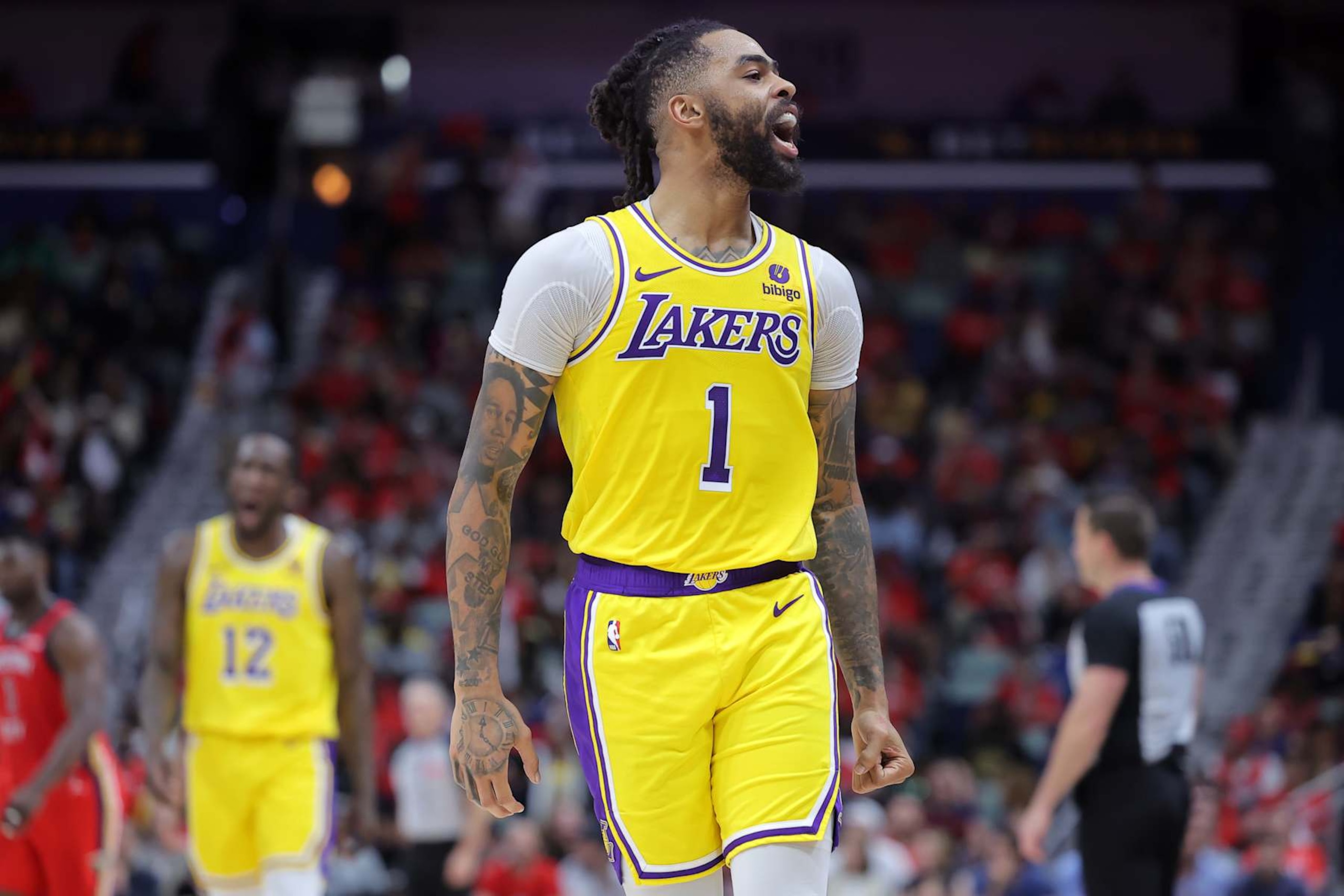 NEW ORLEANS, LOUISIANA - APRIL 16: D'Angelo Russell #1 of the Los Angeles Lakers celebrates during the first half of a game against the New Orleans Pelicans at the Smoothie King Center on April 16, 2024 in New Orleans, Louisiana. NOTE TO USER: User expressly acknowledges and agrees that, by downloading and or using this Photograph, user is consenting to the terms and conditions of the Getty Images License Agreement. (Photo by Jonathan Bachman/Getty Images)
