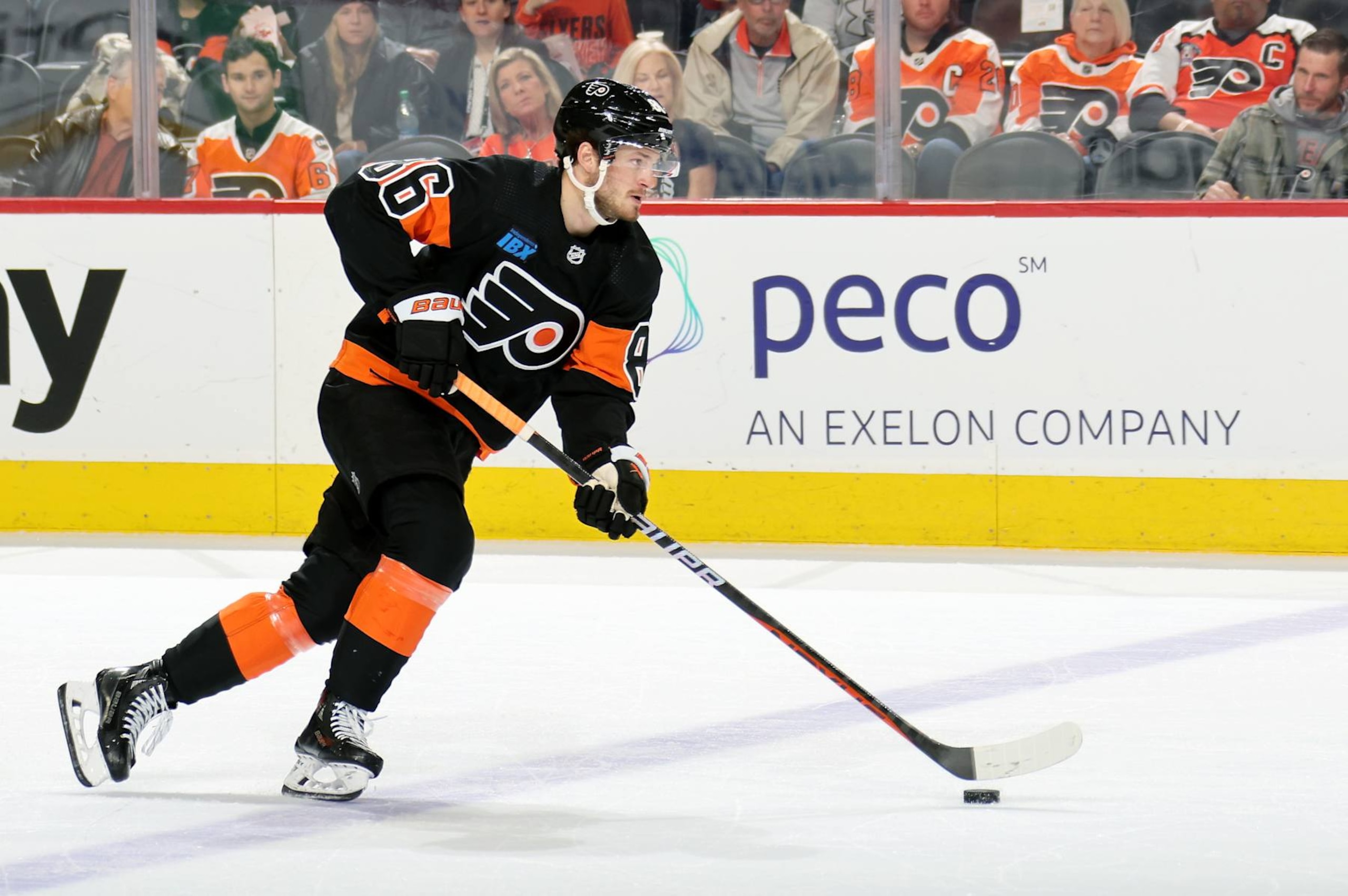 PHILADELPHIA, PENNSYLVANIA - MARCH 23:  Joel Farabee #86 of the Philadelphia Flyers skates the puck against the Boston Bruins at the Wells Fargo Center on March 23, 2024 in Philadelphia, Pennsylvania.  (Photo by Len Redkoles/NHLI via Getty Images)
