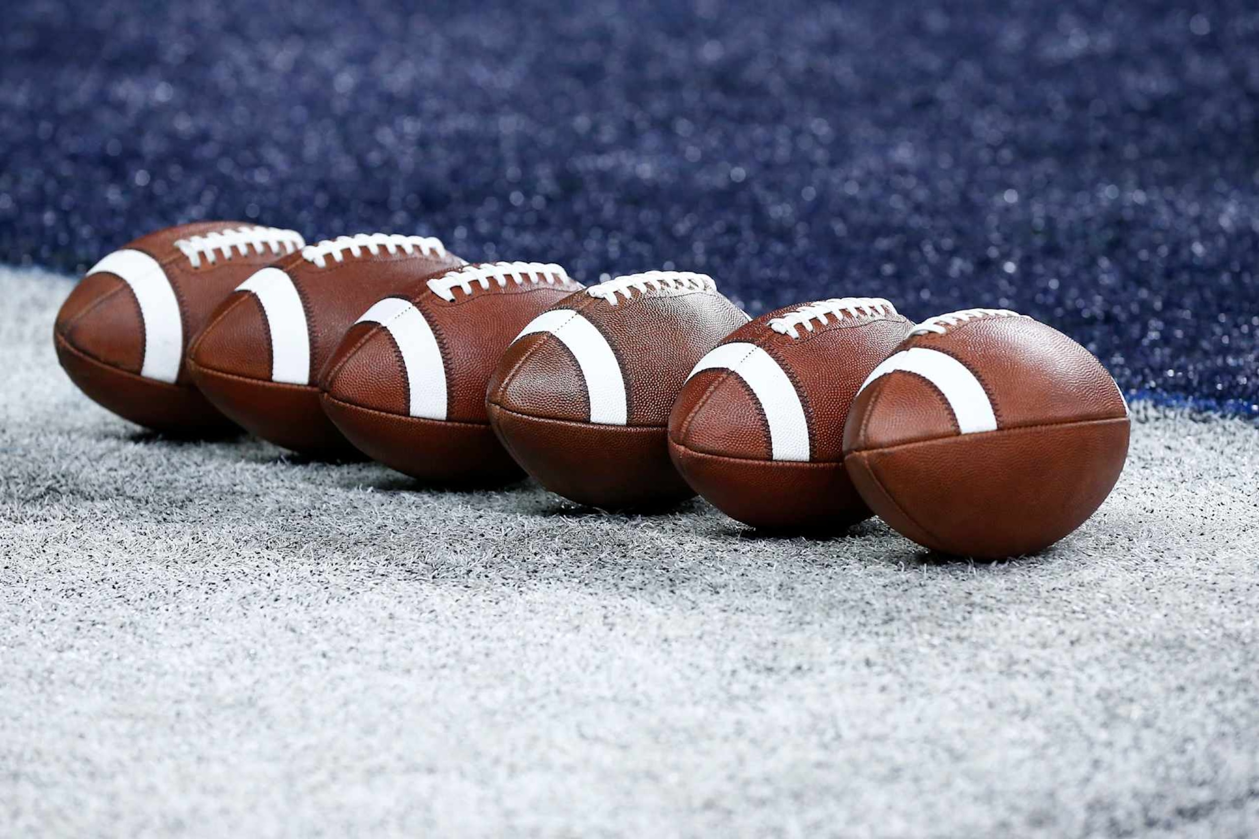 INDIANAPOLIS, IN - DECEMBER 02: Several footballs sit on the sideline prior to the start of the Big Ten Championship Game between the Michigan Wolverines and the Iowa Hawkeyes on December 02, 2023 at Lucas Oil Stadium in Indianapolis,IN. (Photo by Jeffrey Brown/Icon Sportswire via Getty Images) INDIANAPOLIS, IN - DECEMBER 02: Several footballs sit on the sideline prior to the start of the Big Ten Championship Game between the Michigan Wolverines and the Iowa Hawkeyes on December 02, 2023 at Lucas Oil Stadium in Indianapolis,IN. (Photo by Jeffrey Brown/Icon Sportswire via Getty Images)