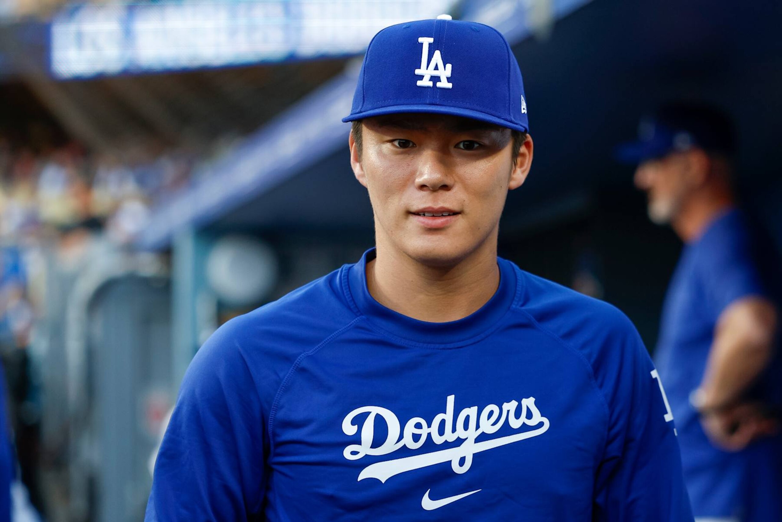 LOS ANGELES, CALIFORNIA - AUGUST 7: Yoshinobu Yamamoto #18 of the Los Angeles Dodgers walks through the dugout prior to a game against the Philadelphia Phillies at Dodger Stadium on August 7, 2024 in Los Angeles, California. (Photo by Brandon Sloter/Image Of Sport/Getty Images)