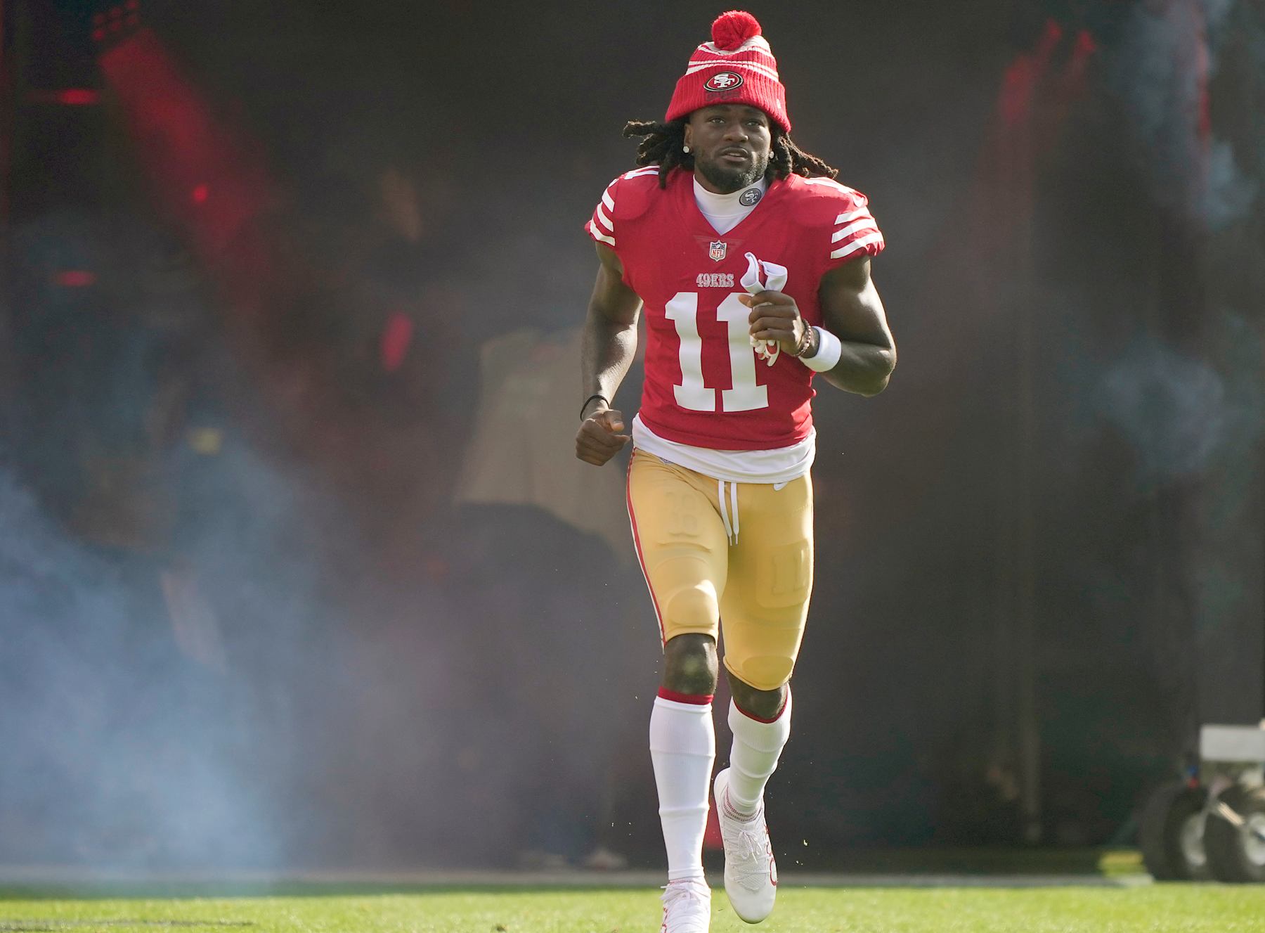 SANTA CLARA, CALIFORNIA - DECEMBER 24: Brandon Aiyuk #11 of the San Francisco 49ers runs onto the field during player introduction prior to the start of the game against the Washington Commanders at Levi's Stadium on December 24, 2022 in Santa Clara, California. (Photo by Thearon W. Henderson/Getty Images)