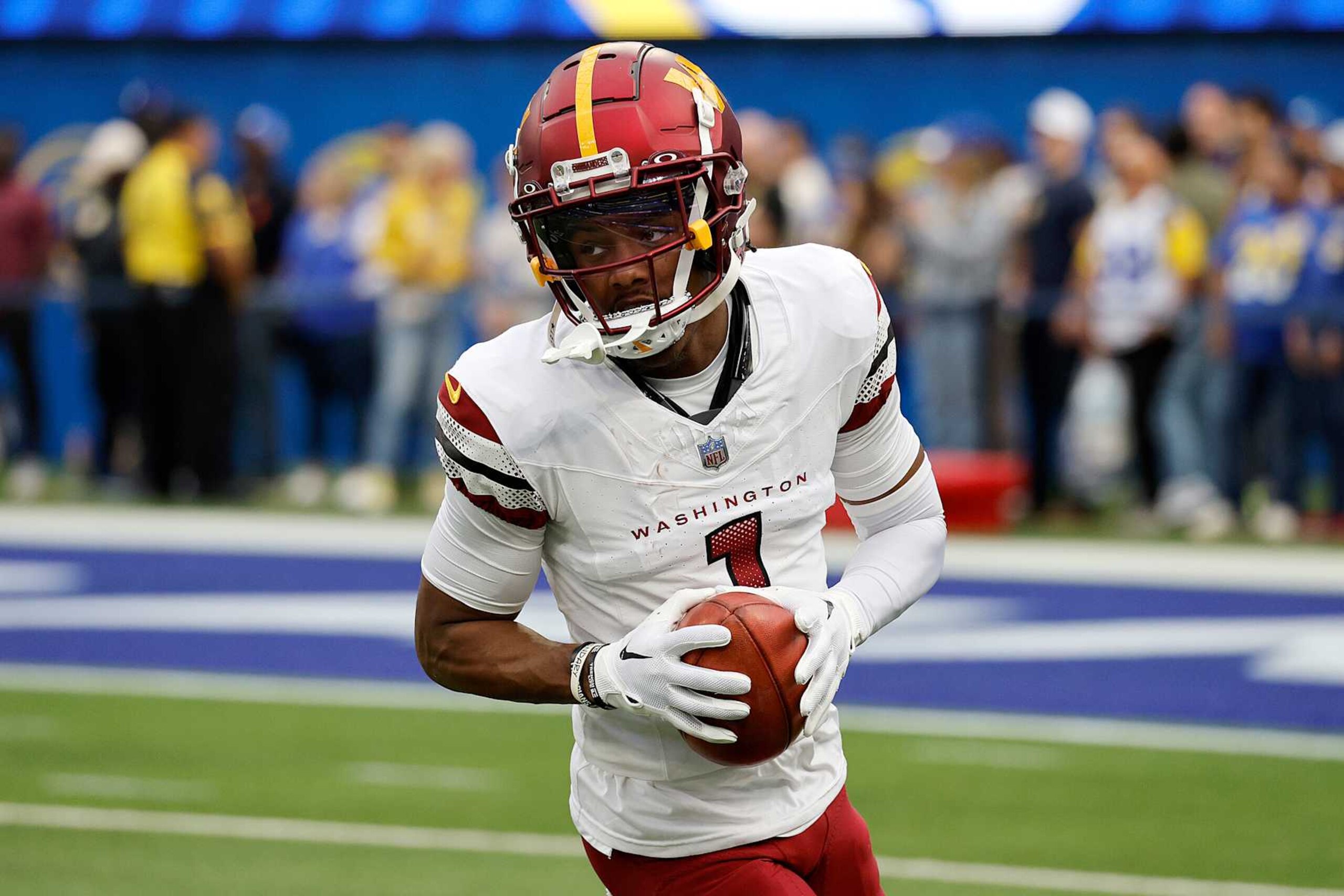 INGLEWOOD, CALIFORNIA - DECEMBER 17: Jahan Dotson #1 of the Washington Commanders warms up before the game against the Los Angeles Rams at SoFi Stadium on December 17, 2023 in Inglewood, California. (Photo by Kevork Djansezian/Getty Images)