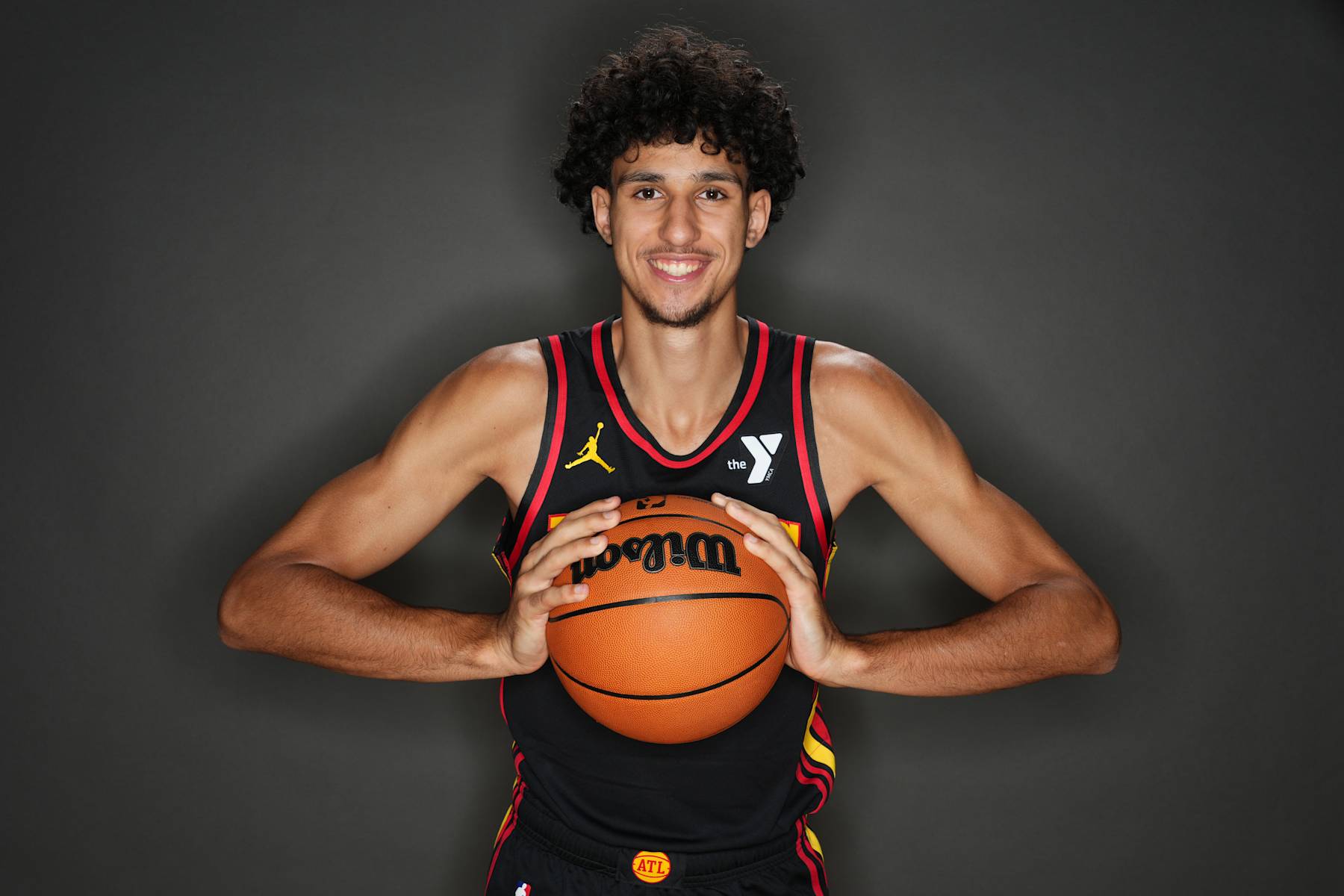 LAS VEGAS, NV - JULY 16: Zaccharie Risacher #10 of the Atlanta Hawks poses for a portrait during the 2024 NBA Rookie Photo Shoot on July 16, 2024 at the University of Nevada, Las Vegas campus in Las Vegas, Nevada. NOTE TO USER: User expressly acknowledges and agrees that, by downloading and/or using this Photograph, user is consenting to the terms and conditions of the Getty Images License Agreement. Mandatory Copyright Notice: Copyright 2024 NBAE (Photo by Jeff Bottari/NBAE via Getty Images)