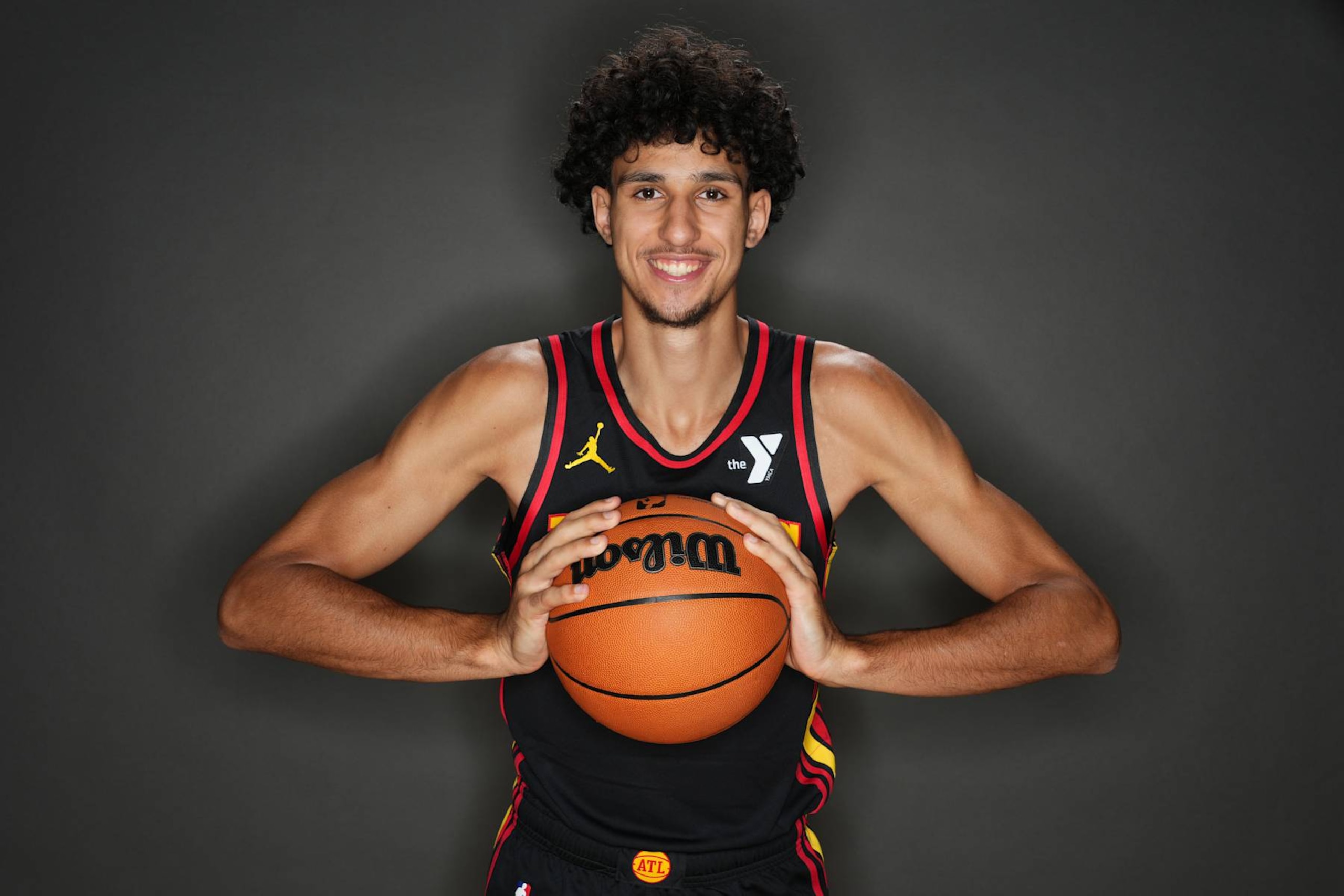 LAS VEGAS, NV - JULY 16: Zaccharie Risacher #10 of the Atlanta Hawks poses for a portrait during the 2024 NBA Rookie Photo Shoot on July 16, 2024 at the University of Nevada, Las Vegas campus in Las Vegas, Nevada. NOTE TO USER: User expressly acknowledges and agrees that, by downloading and/or using this Photograph, user is consenting to the terms and conditions of the Getty Images License Agreement. Mandatory Copyright Notice: Copyright 2024 NBAE (Photo by Jeff Bottari/NBAE via Getty Images)