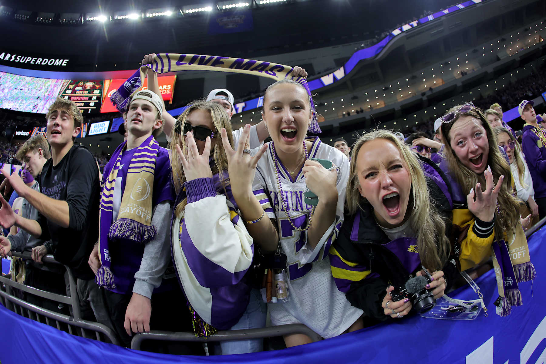 NEW ORLEANS, LOUISIANA - JANUARY 01: Washington Huskies fans celebrate after a 37-31 victory against the Texas Longhorns in the CFP Semifinal Allstate Sugar Bowl at Caesars Superdome on January 01, 2024 in New Orleans, Louisiana. (Photo by Jonathan Bachman/Getty Images)