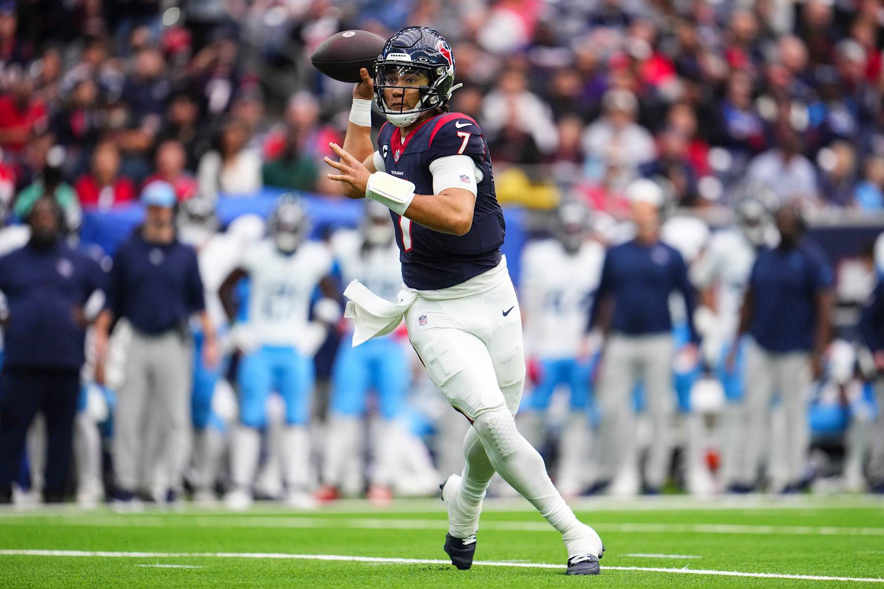HOUSTON, TX - DECEMBER 31: C.J. Stroud #7 of the Houston Texans throws the ball during an NFL football game against the Tennessee Titans at NRG Stadium on December 31, 2023 in Houston, Texas. (Photo by Cooper Neill/Getty Images)