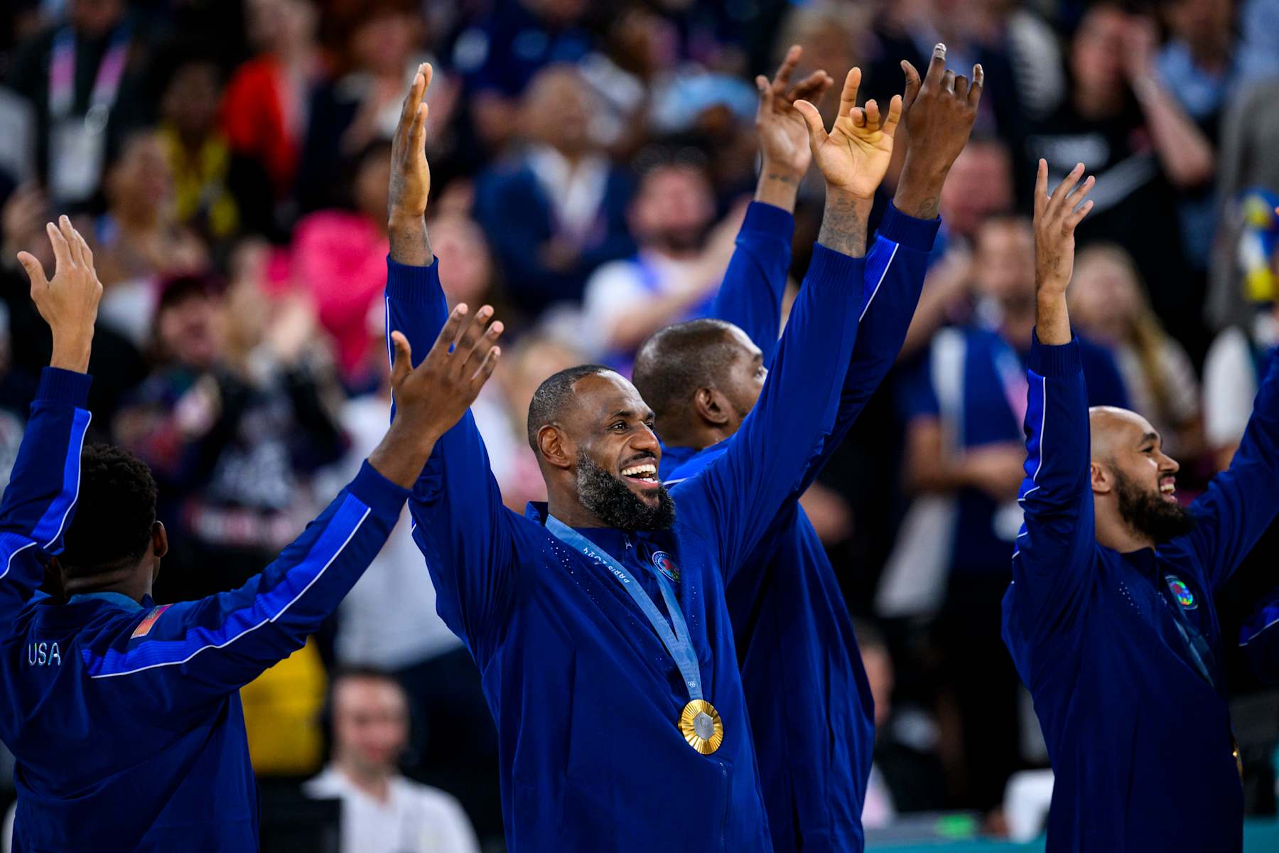 PARIS, FRANCE - AUGUST 11: Gold medalist LeBron James of Team United States celebrate on the podium during the Men's basketball medal ceremony on day fifteen of the Olympic Games Paris 2024 at the Bercy Arena on August 11, 2024 in Paris, France. (Photo by Tom Weller/VOIGT/GettyImages)