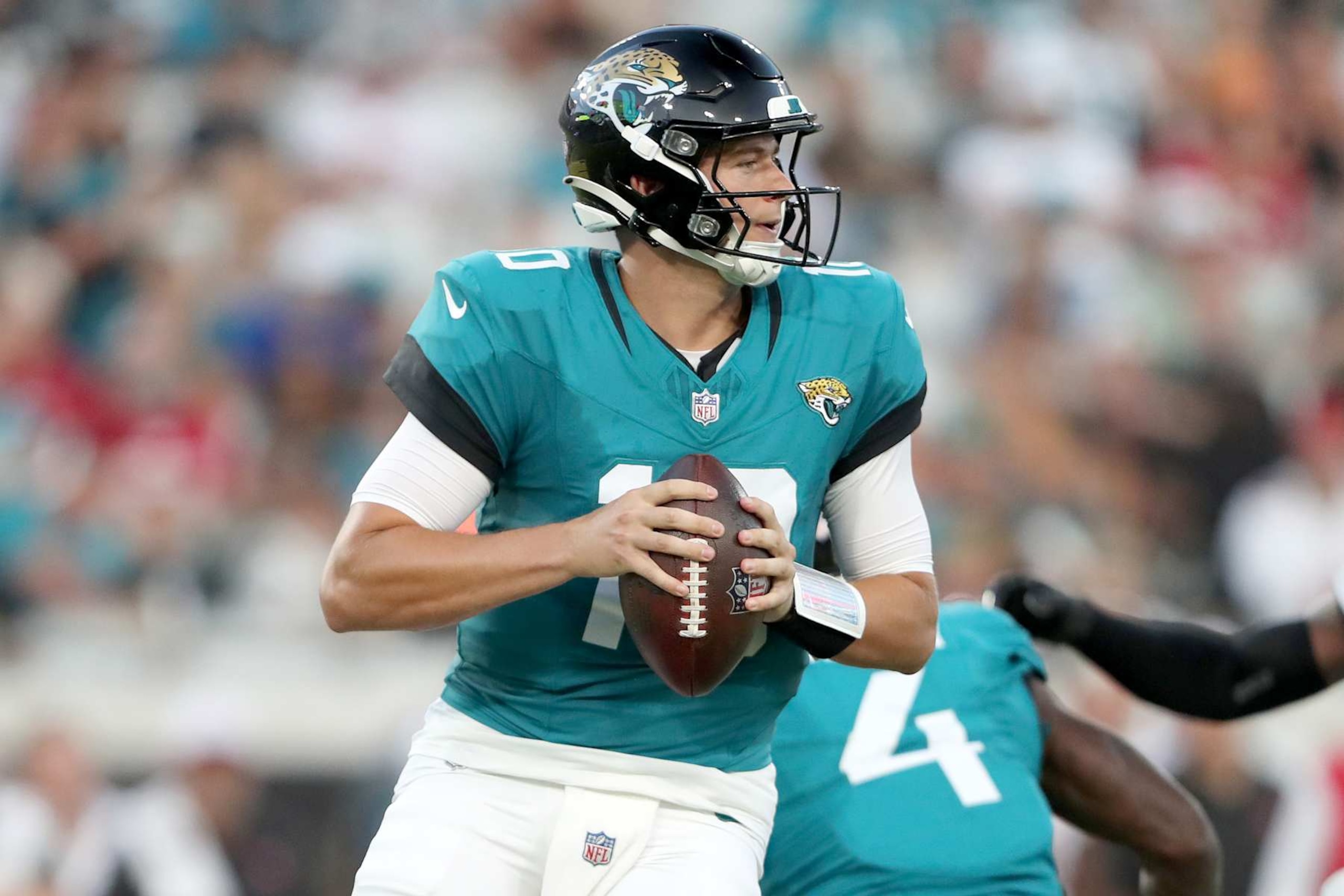 JACKSONVILLE, FLORIDA - AUGUST 17: Mac Jones #10 of the Jacksonville Jaguars drops back to pass during the first half of a preseason game against the Tampa Bay Buccaneers at EverBank Stadium on August 17, 2024 in Jacksonville, Florida. (Photo by Courtney Culbreath/Getty Images)