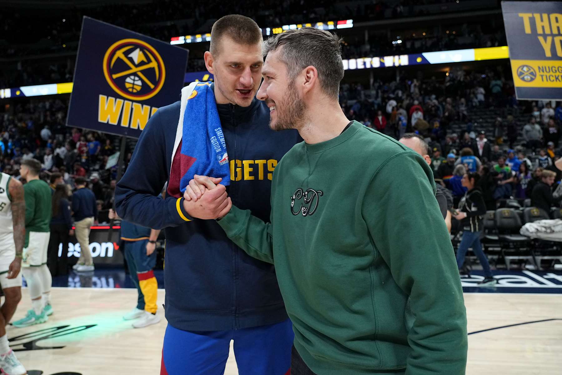 DENVER, CO - MARCH 25: Nikola Jokic #15 of the Denver Nuggets high fives Goran Dragic of the Milwaukee Bucks after the game on March 25, 2023 at the Ball Arena in Denver, Colorado. NOTE TO USER: User expressly acknowledges and agrees that, by downloading and/or using this Photograph, user is consenting to the terms and conditions of the Getty Images License Agreement. Mandatory Copyright Notice: Copyright 2023 NBAE (Photo by Bart Young/NBAE via Getty Images)