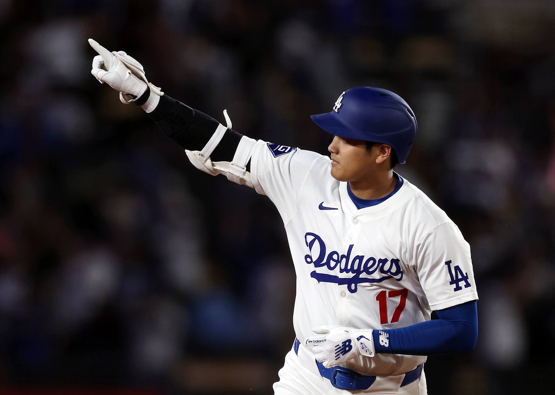 LOS ANGELES, CALIFORNIA - AUGUST 23: Shohei Ohtani #17 of the Los Angeles Dodgers celebrates after hitting a walk-off grand slam home run, his 40th home run of the season, against the Tampa Bay Rays at Dodger Stadium on August 23, 2024 in Los Angeles, California. (Photo by Katelyn Mulcahy/Getty Images)
